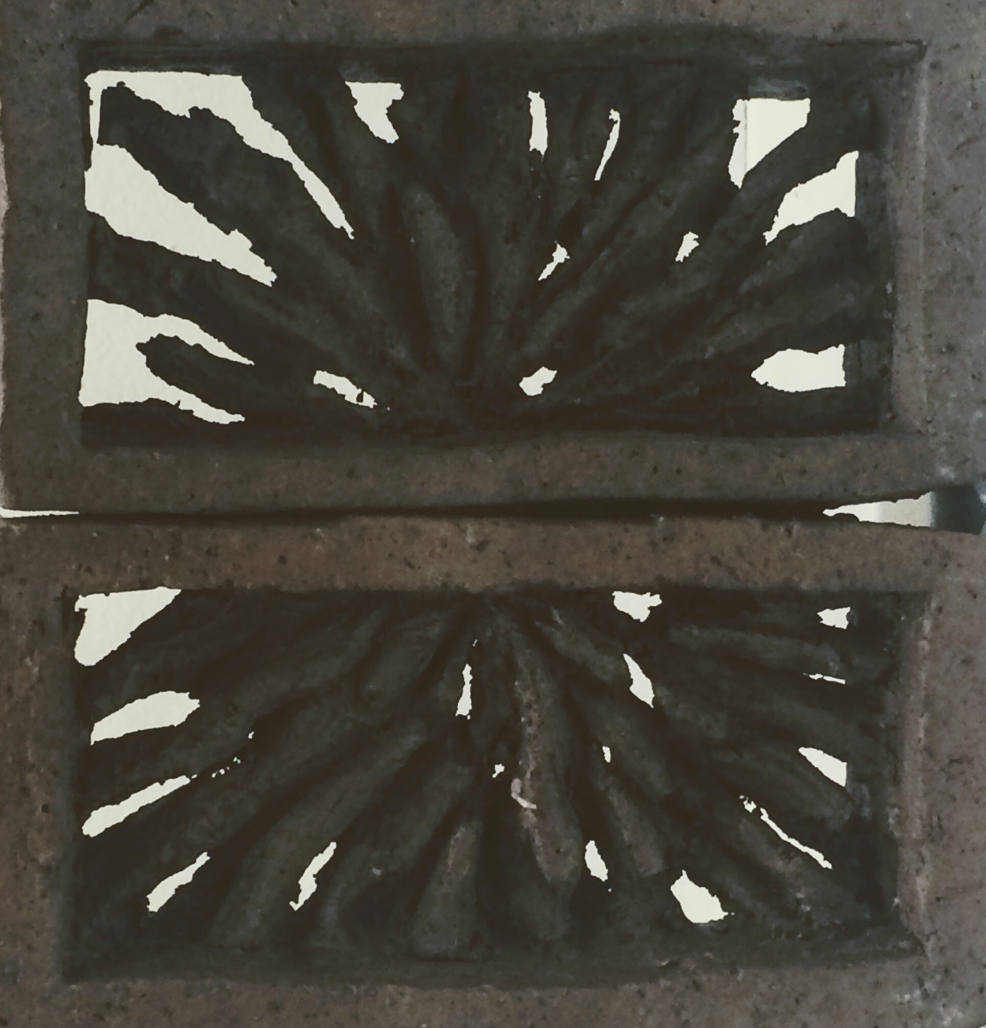 Sunburst motif in interior of bricks creates small sculpture