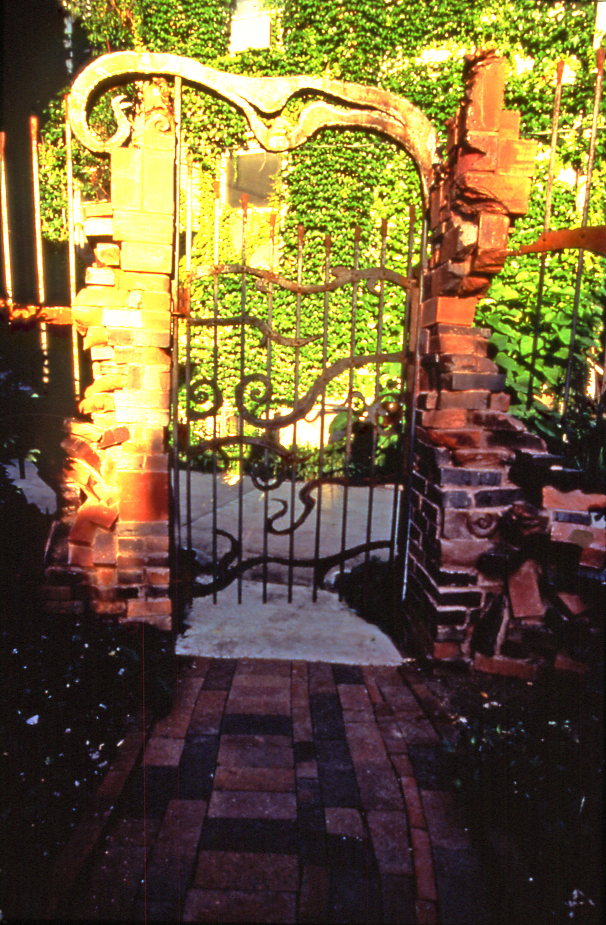 gate of Keraunos garden, iron and carved brickwork columns