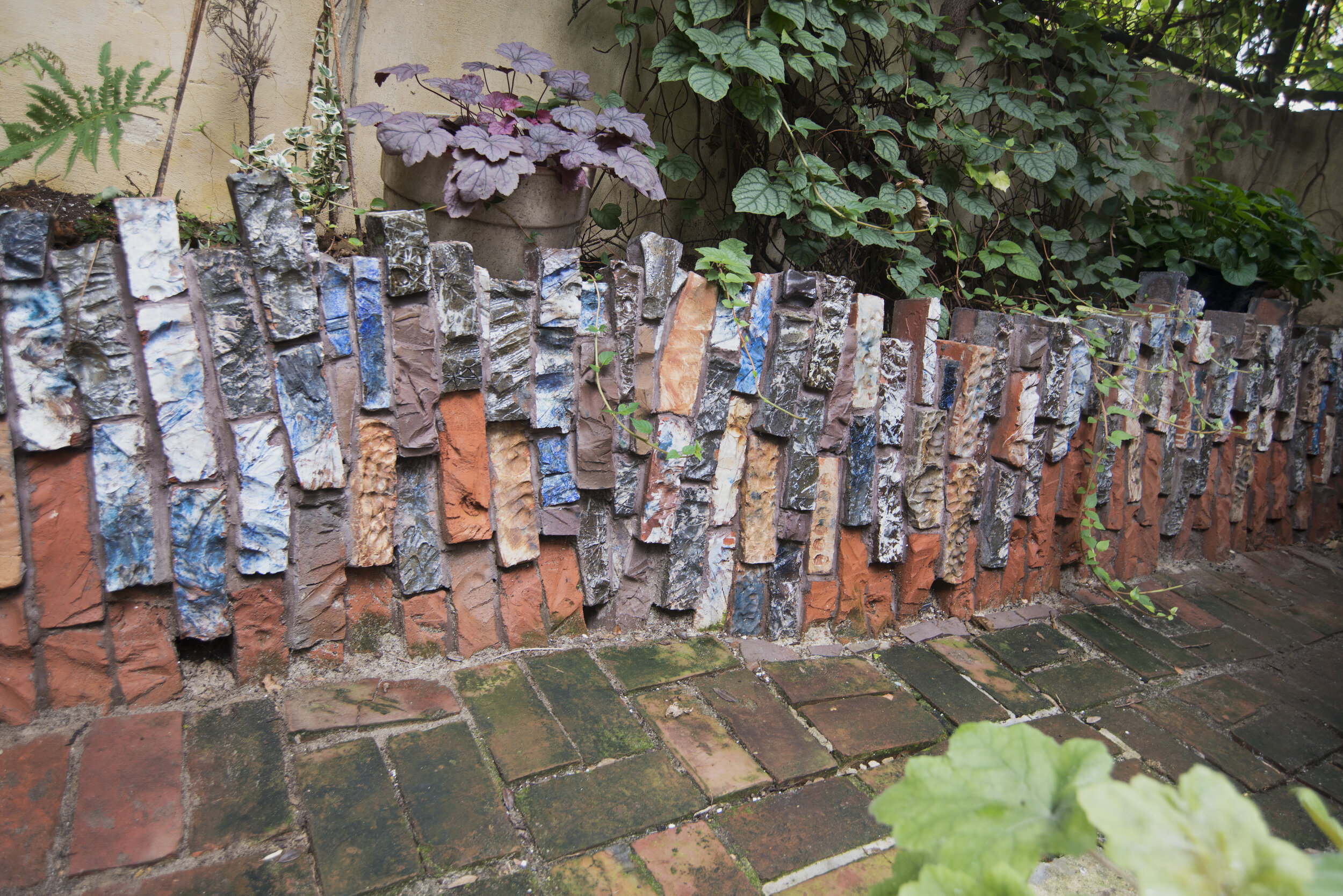 Garden Wall of colorful salt glazed carved brick in Philadelphia