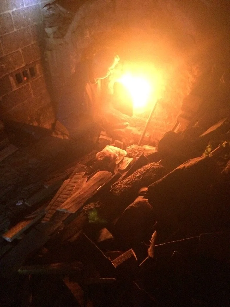 Feeding the firs during recent kiln firing at Michael’s Philadelphia kiln.