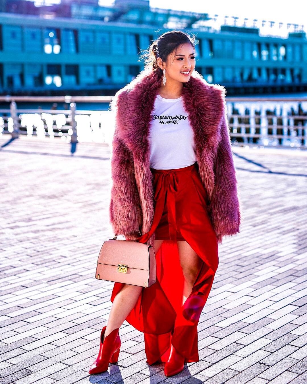 Claire featuring sustainability in her February 2019 New York Fashion Week look, including a sustainably made, organic cotton top, a rented faux fur coat, and a skirt purchased in 2015.