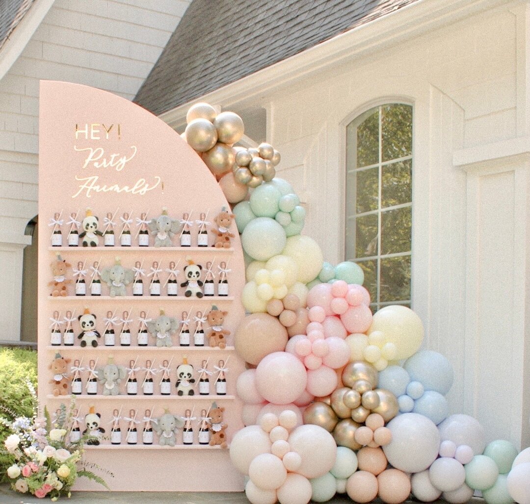 The ultimate Party Animal favor wall filled with mini champagne bottles for the adults and stuffed animals for the little ones! 

Balloons: @balloonsbycaro
Flowers: @av_design_nj 
Rentals: @bigmamaspartyrentals
Sign: @creativeamme
Tags/labels: @simpl