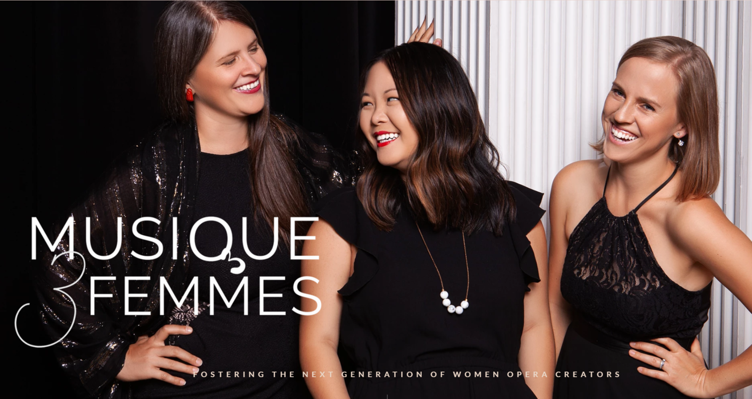 From left to right: Kristin Hoff, Jennifer Szeto, and Rachel Khrem—the Musique 3 Femmes team.Alt text: Three women in black clothing smiling. Towards the bottom left is the M3F logo, and along the bottom centre reads, “FOSTERING THE NEXT GENERATION OF WOMEN OPERA CREATORS”