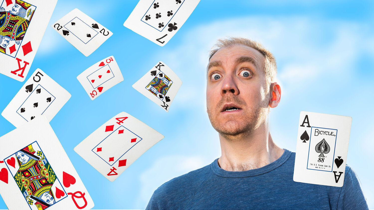 Captions: Chase the Ace poster displaying a comedically terrified Charlie King, played by Mark Crawford, surrounded by several playing cards including the important ace of spades.Photo by Ann Baggley