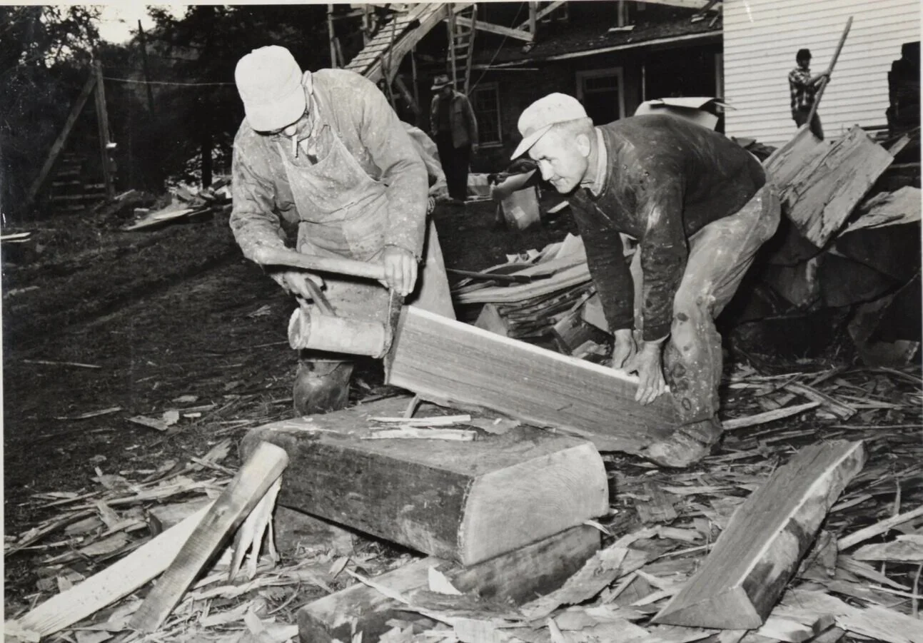 Splitting shingles for the restoration of Compass Inn. The restoration began in 1970, under the direction of Charles M. Stotz of the Pittsburgh Architectural Firm.