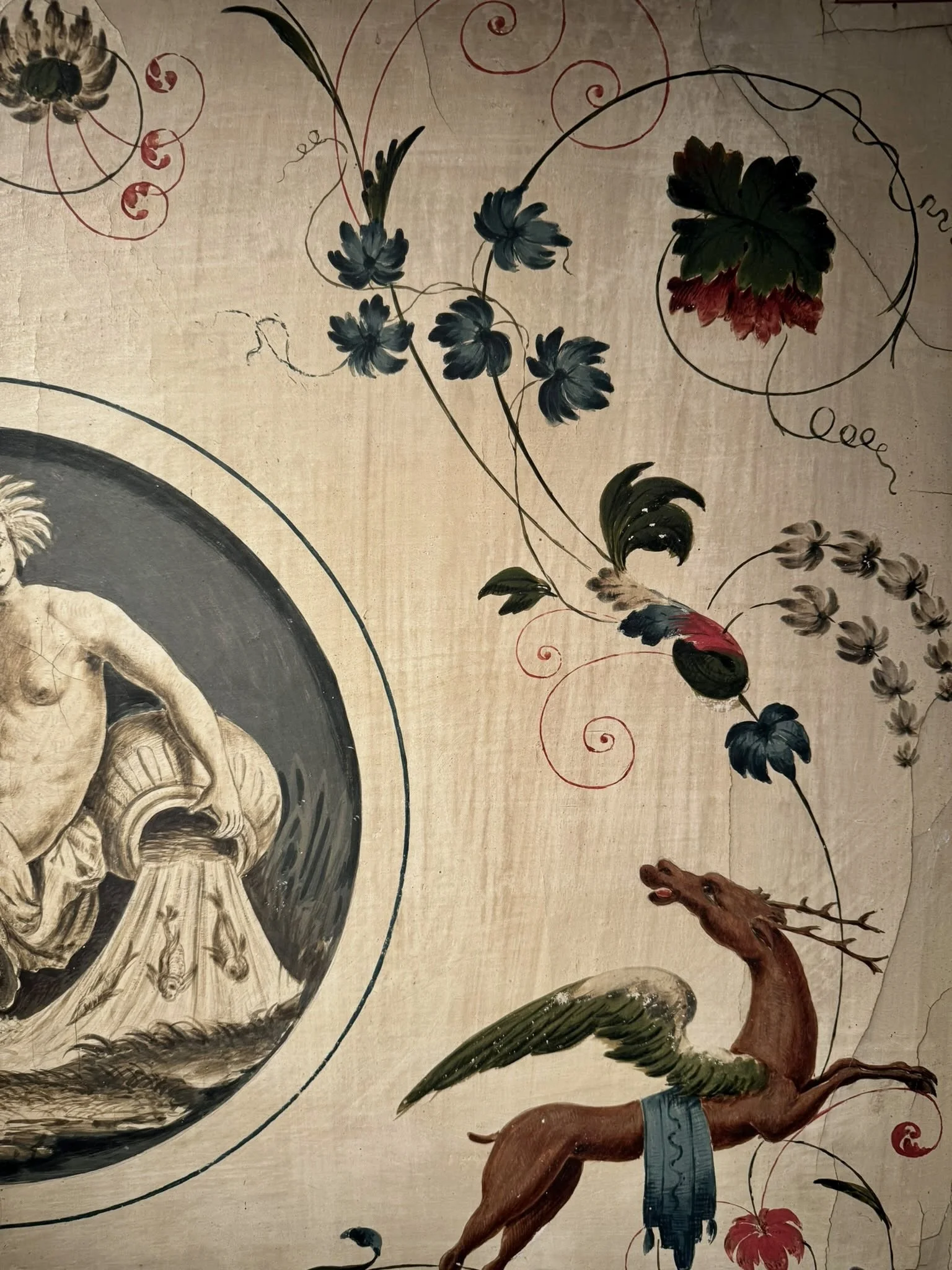 Monumental late 18th-century Italian Neoclassical trumeau mirrors with pale green painted frames, gilded ornamentation, floral panels and exotic birds.