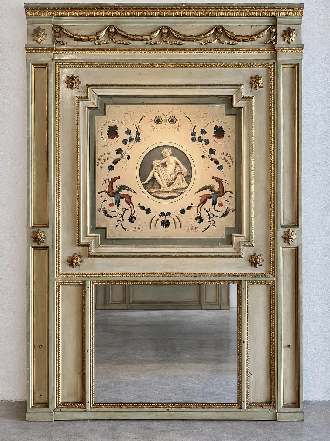 Monumental late 18th-century Italian Neoclassical trumeau mirrors with pale green painted frames, gilded ornamentation, floral panels and exotic birds.