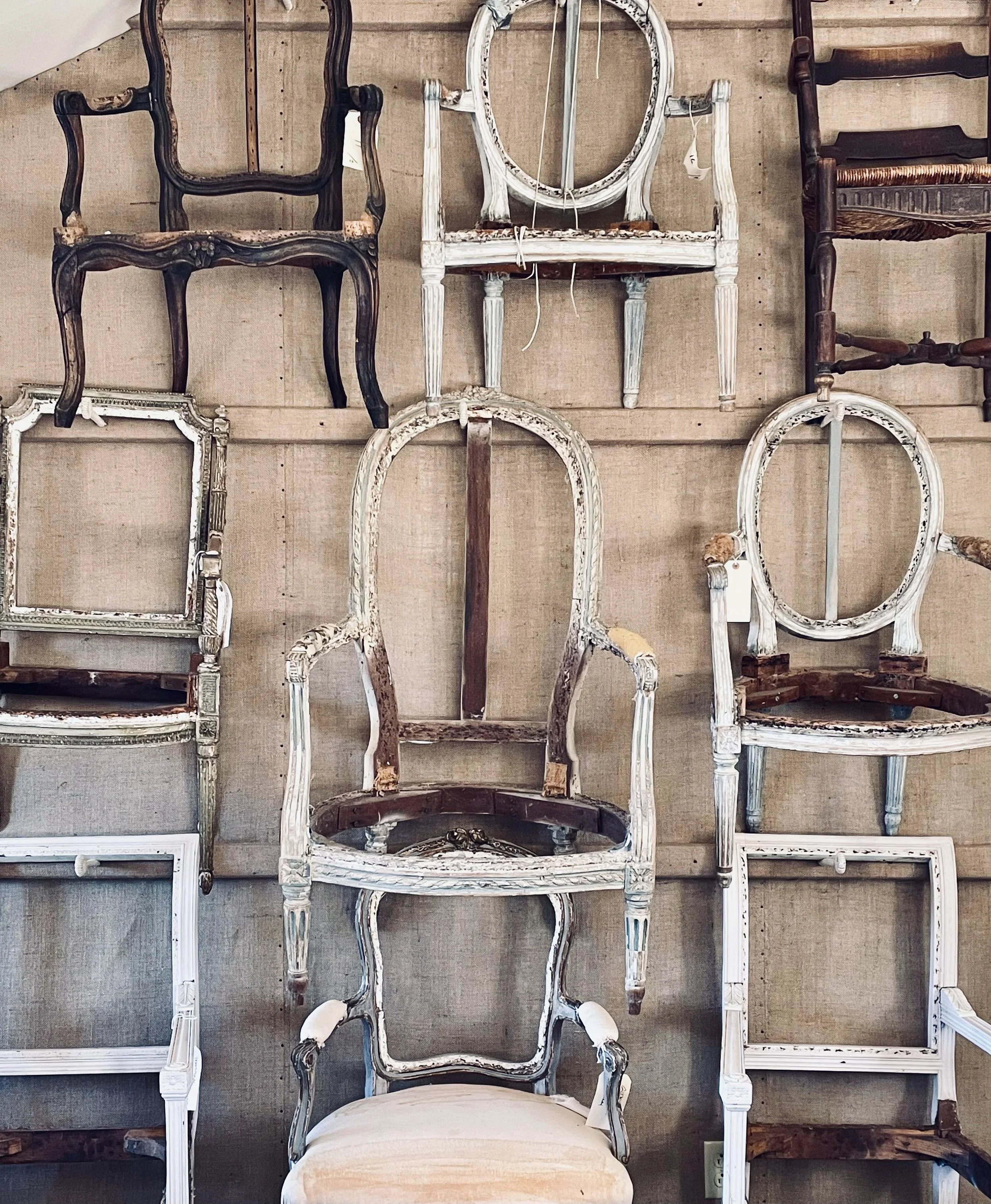 Atelier Kardes wall of chairs.jpeg