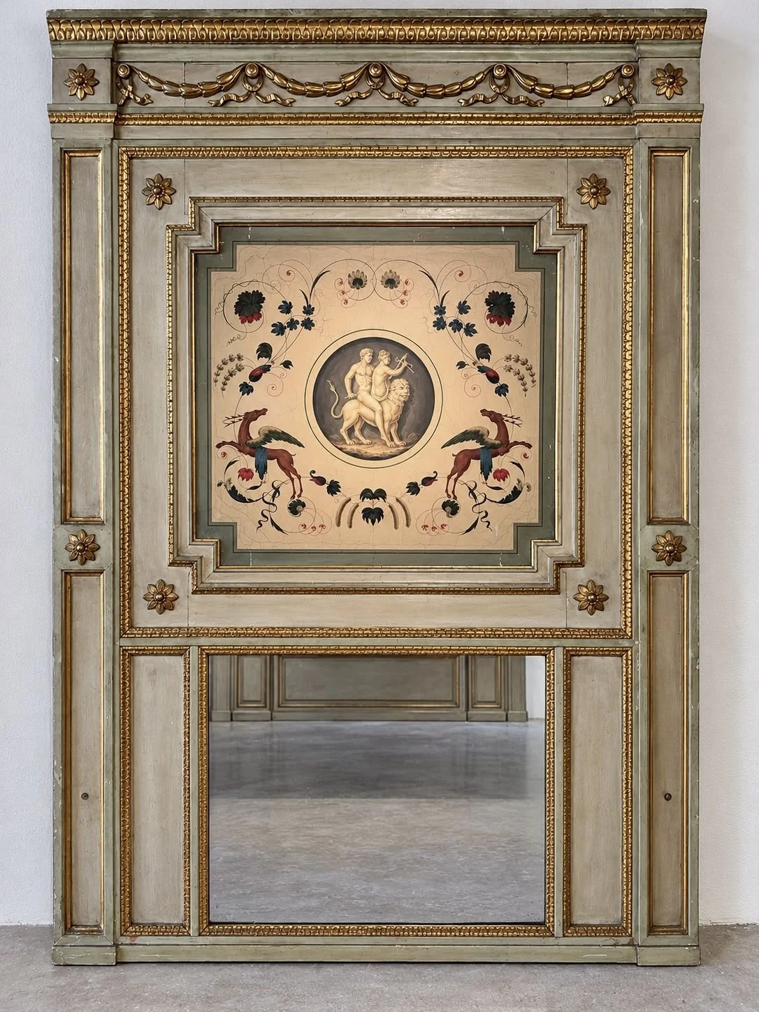 Monumental late 18th-century Italian Neoclassical trumeau mirrors with pale green painted frames, gilded ornamentation, floral panels and exotic birds.