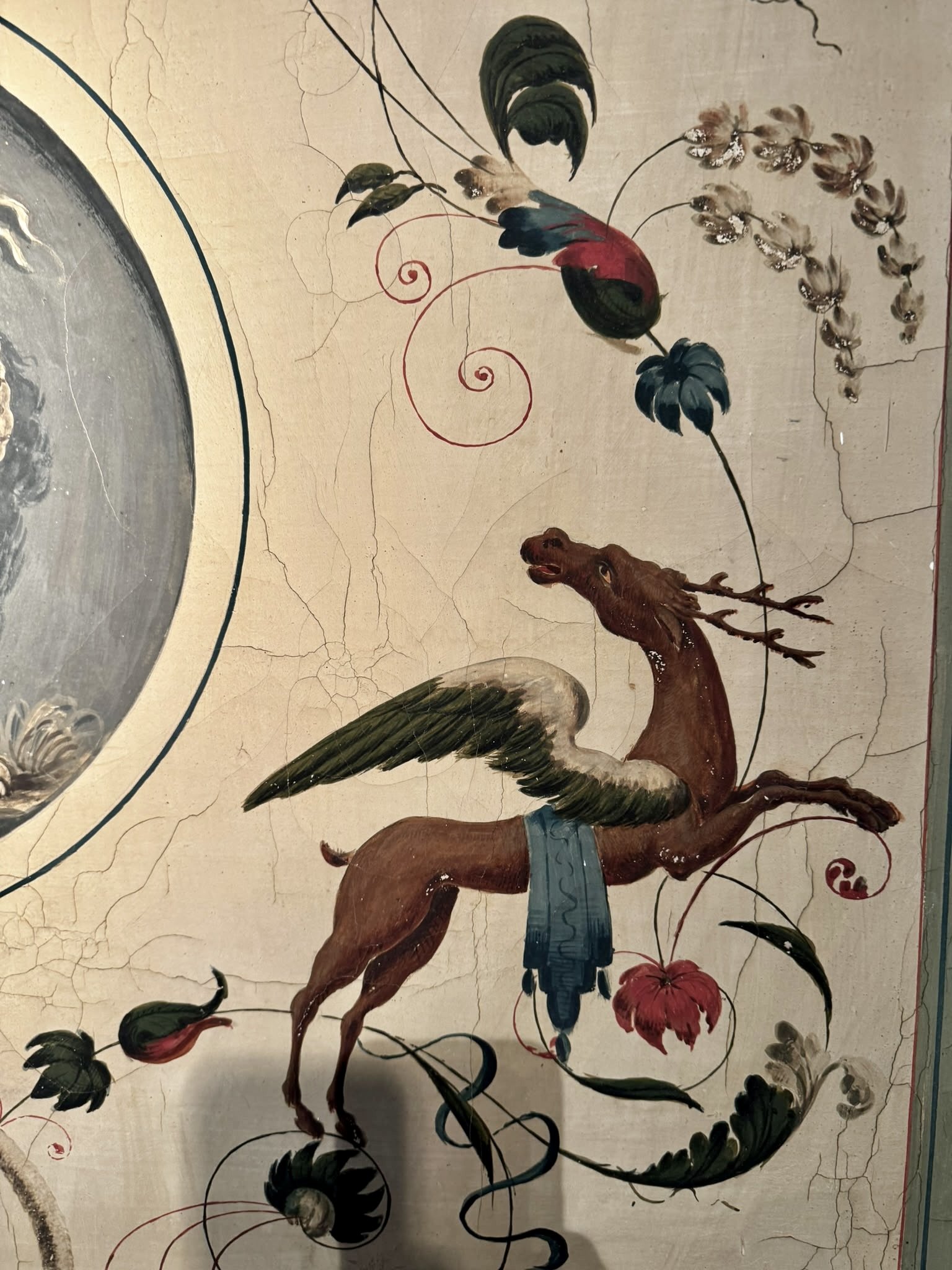 Monumental late 18th-century Italian Neoclassical trumeau mirrors with pale green painted frames, gilded ornamentation, floral panels and exotic birds.
