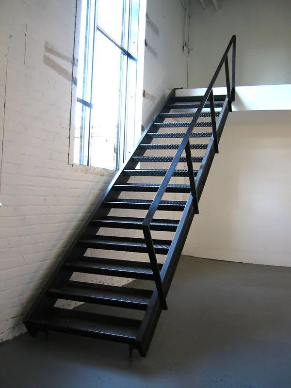Steel stair with diamond plate brake formed treads