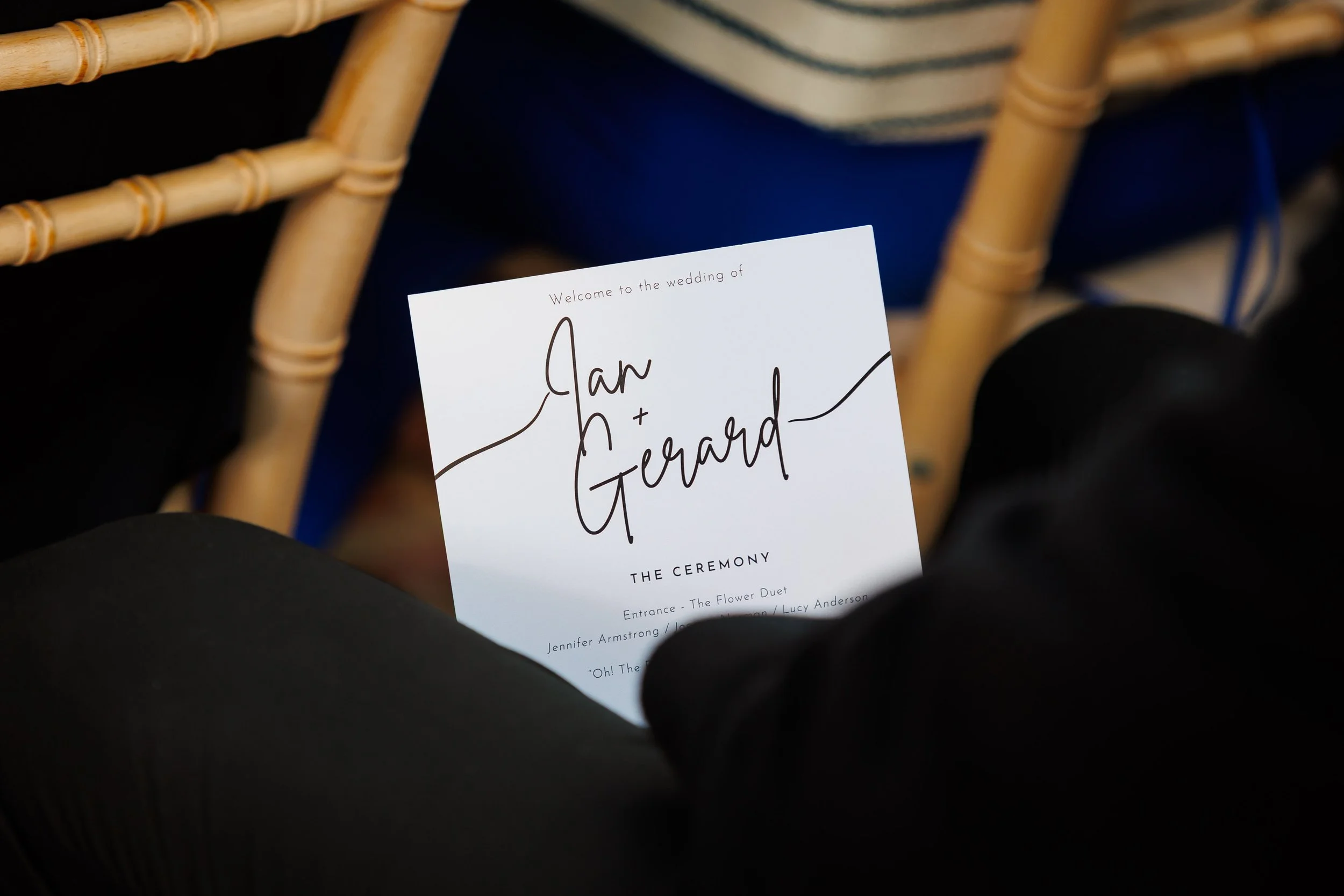 Wedding ceremony order of service resting on a chair before the ceremony.