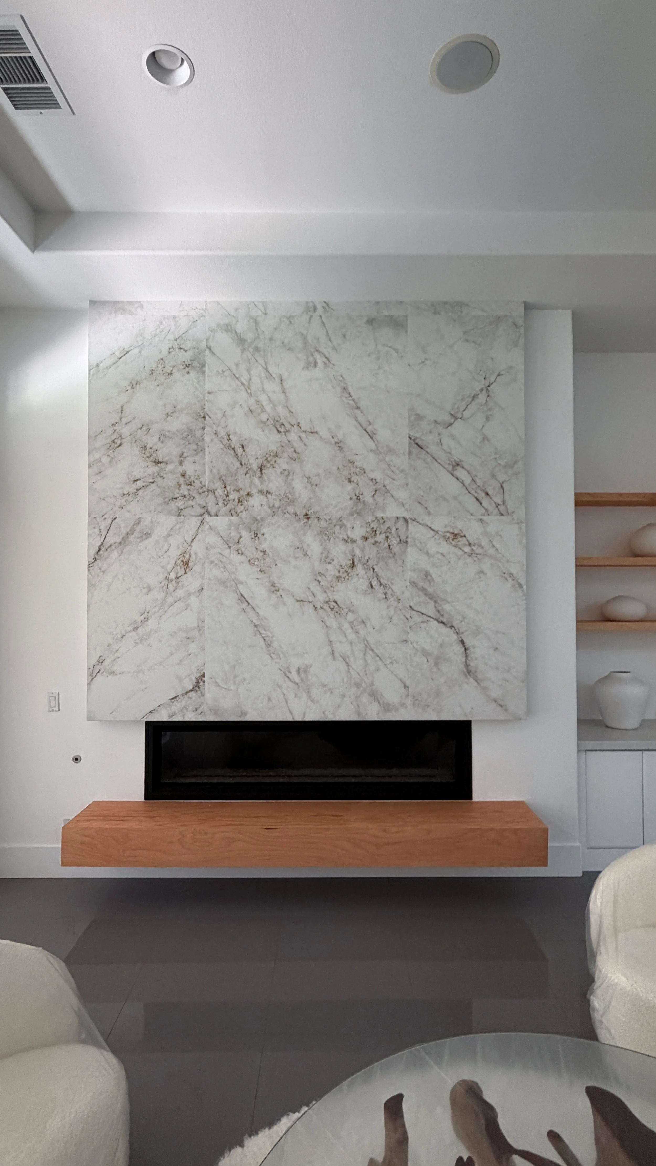 Custom fireplace feature wall with custom seated hearth, custom media wall and cabinetry installation, Southern California