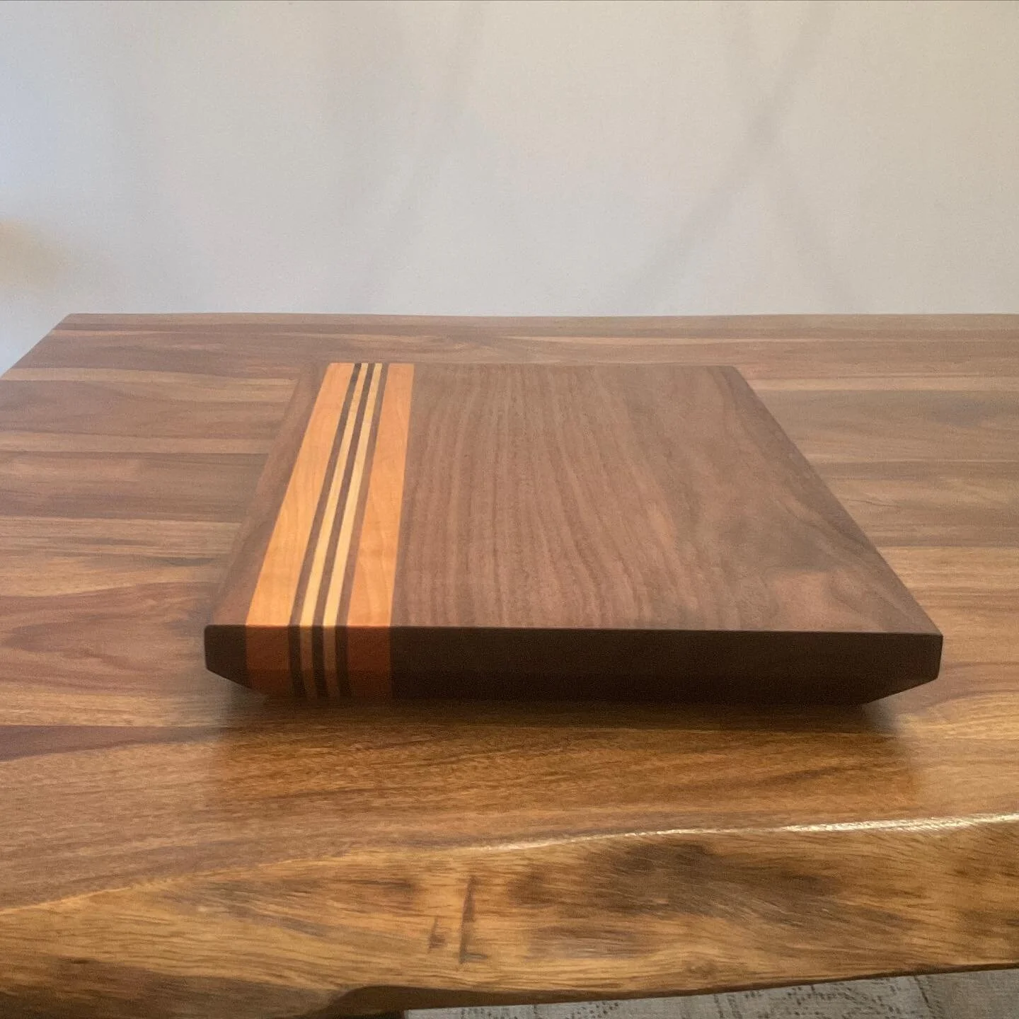 12x18 walnut, maple, cherry cutting board. Some stages of the process. I like the bevel on the underside of this one for picking it up. #staystoked