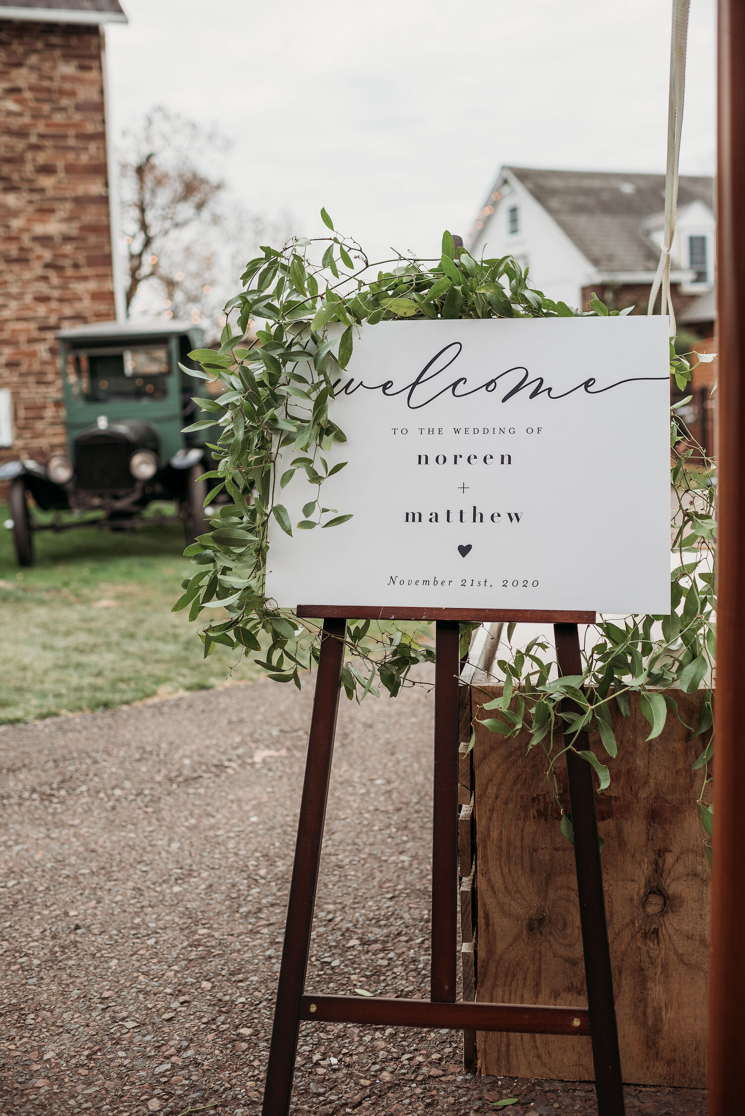 Greenery wrapping welcome sign