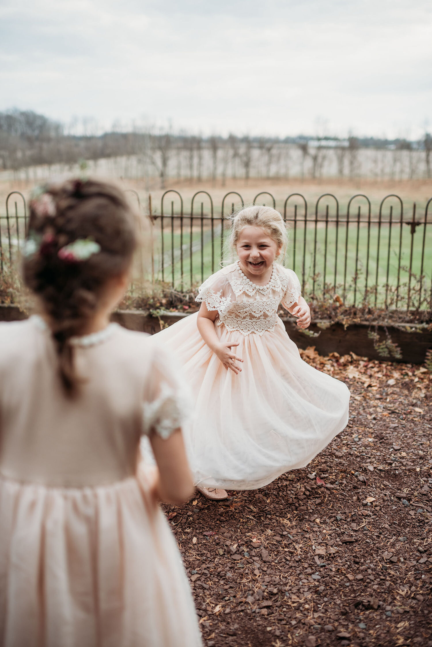 Two flower girls enjoying wedding at Durham Hill Farm.