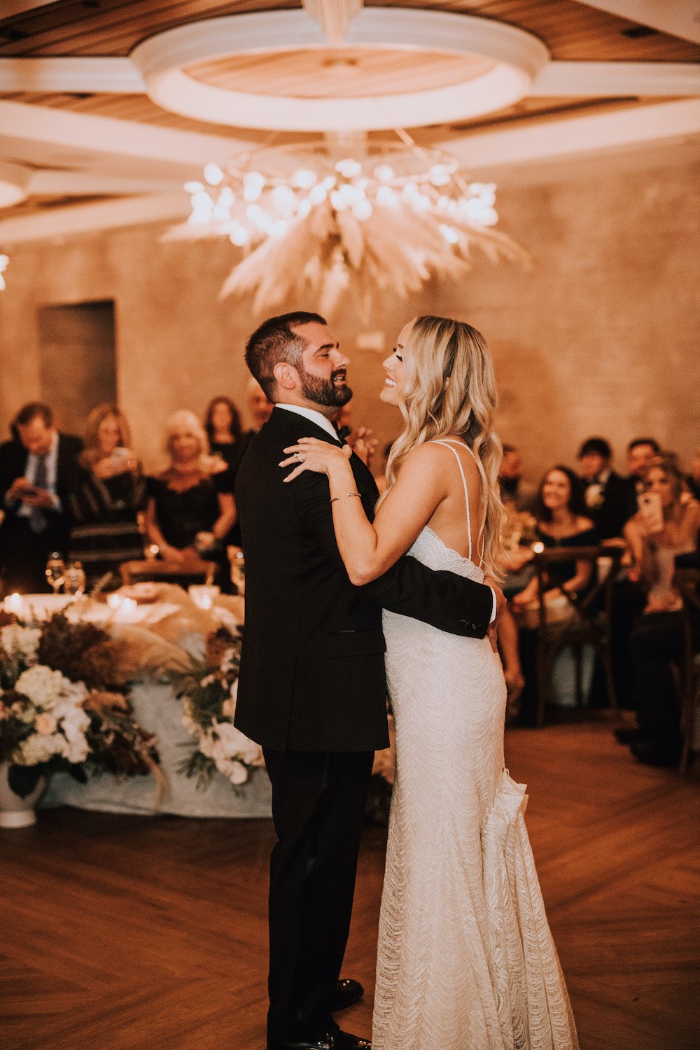 Bride and Groom dancing under the Pampas Grass Ceiling Installation