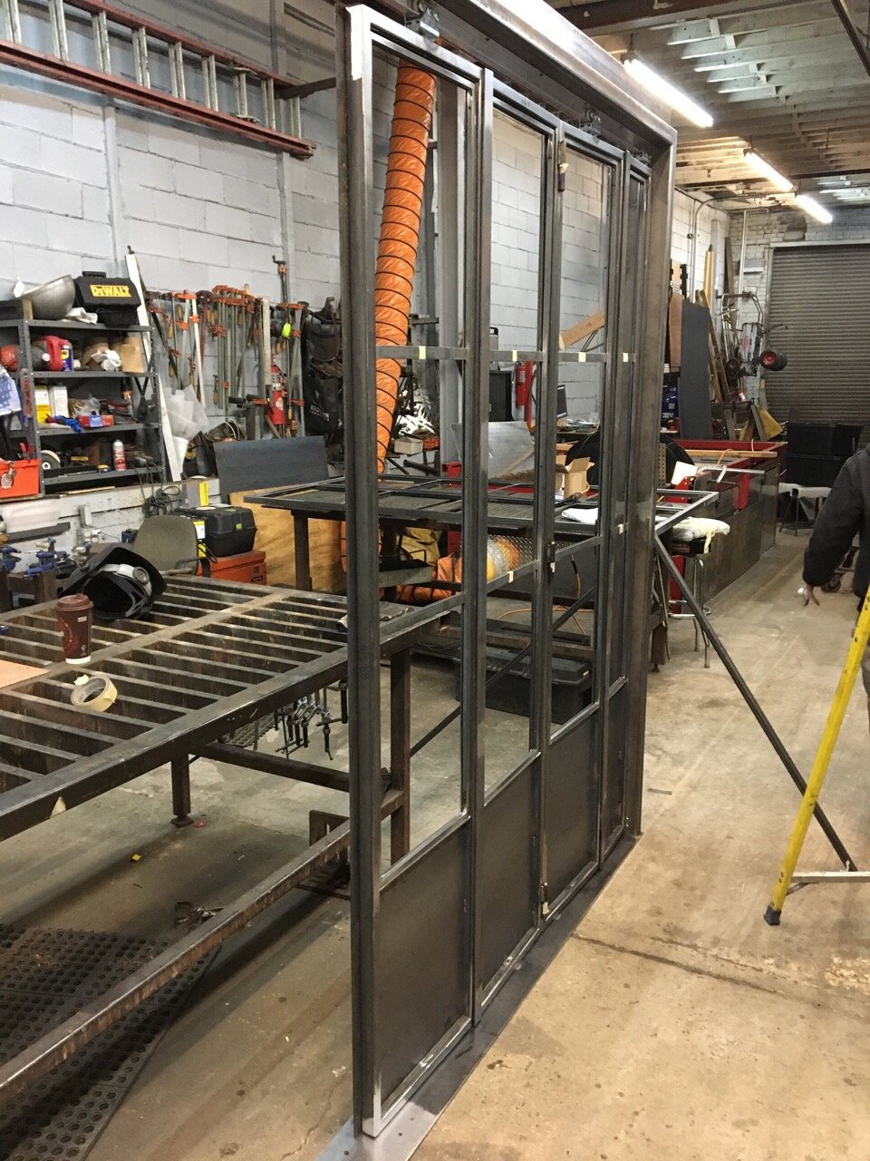 Making sliding steel doors on the shop floor. 