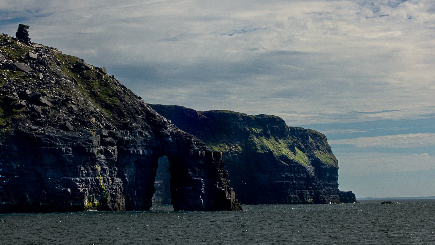 The cliffs of Moher from the water on a beautiful day in Ireland