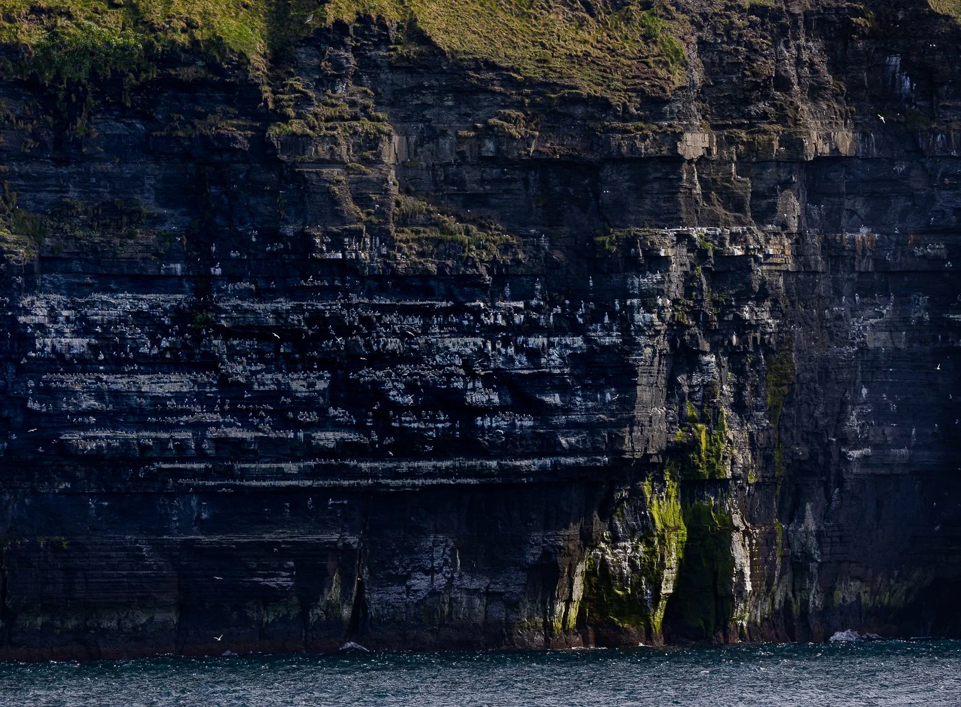 The Cliffs of Moher from the water on a beautiful day in Ireland