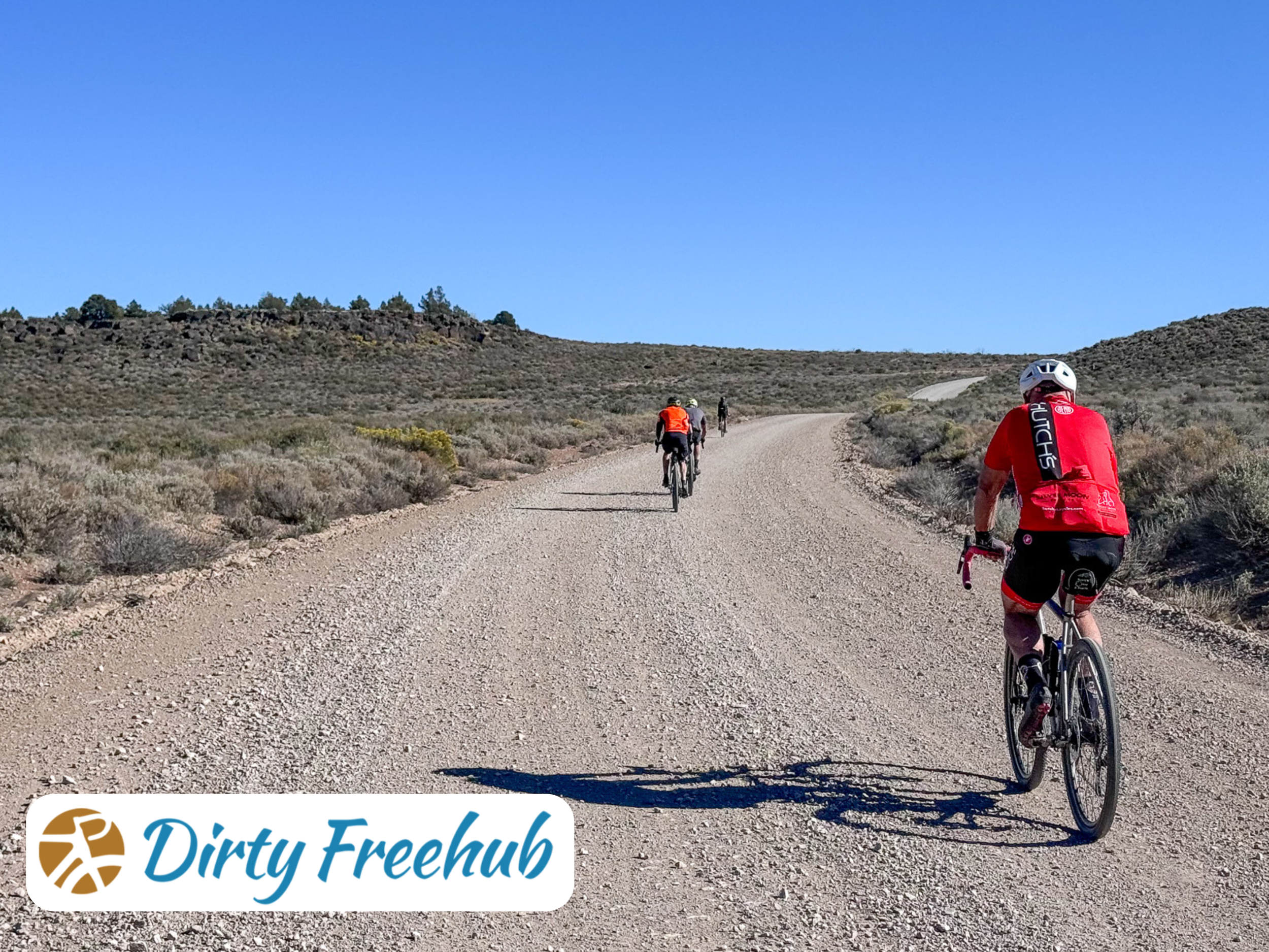 Dirty Freehub gravel ride in Fort Bidwell, Oregon. 3 bike riders on a gravel cycling route, on a well-paved gravel road.