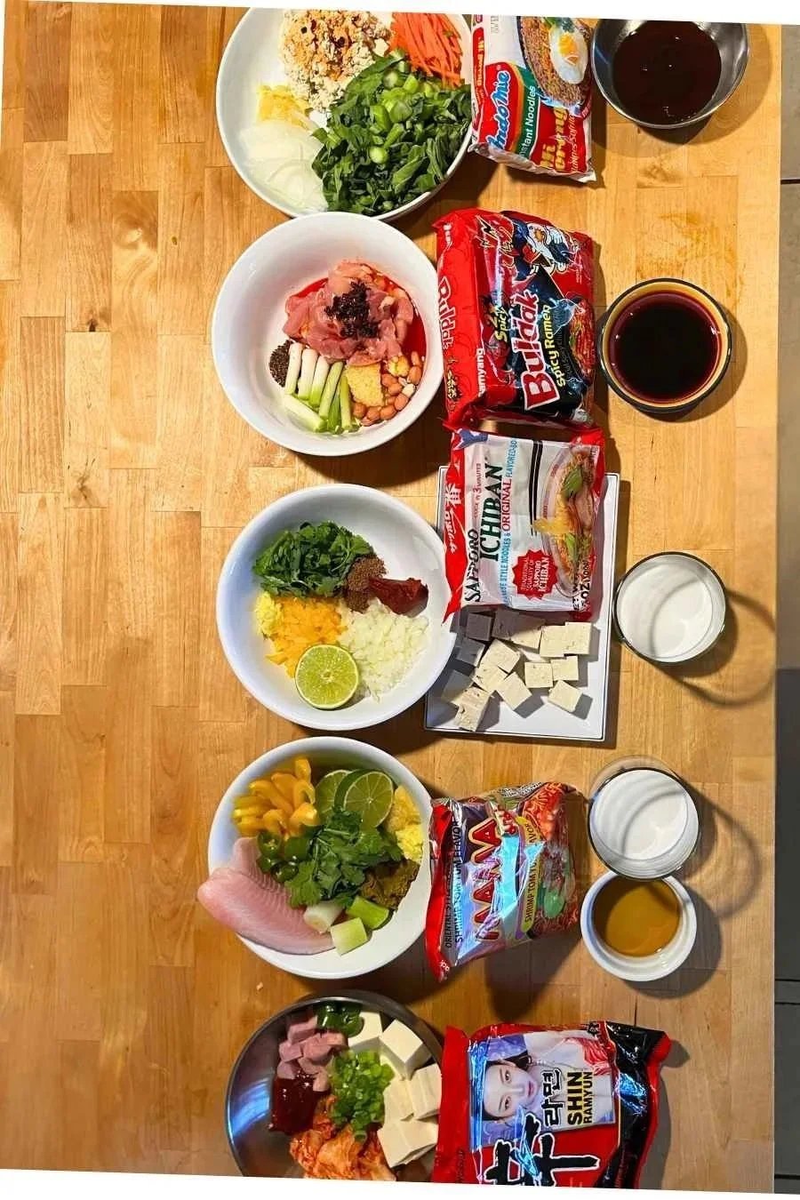 Instant noodle pantry staples laid out with five different noodle brands used to test Instant Noodles and Beyond