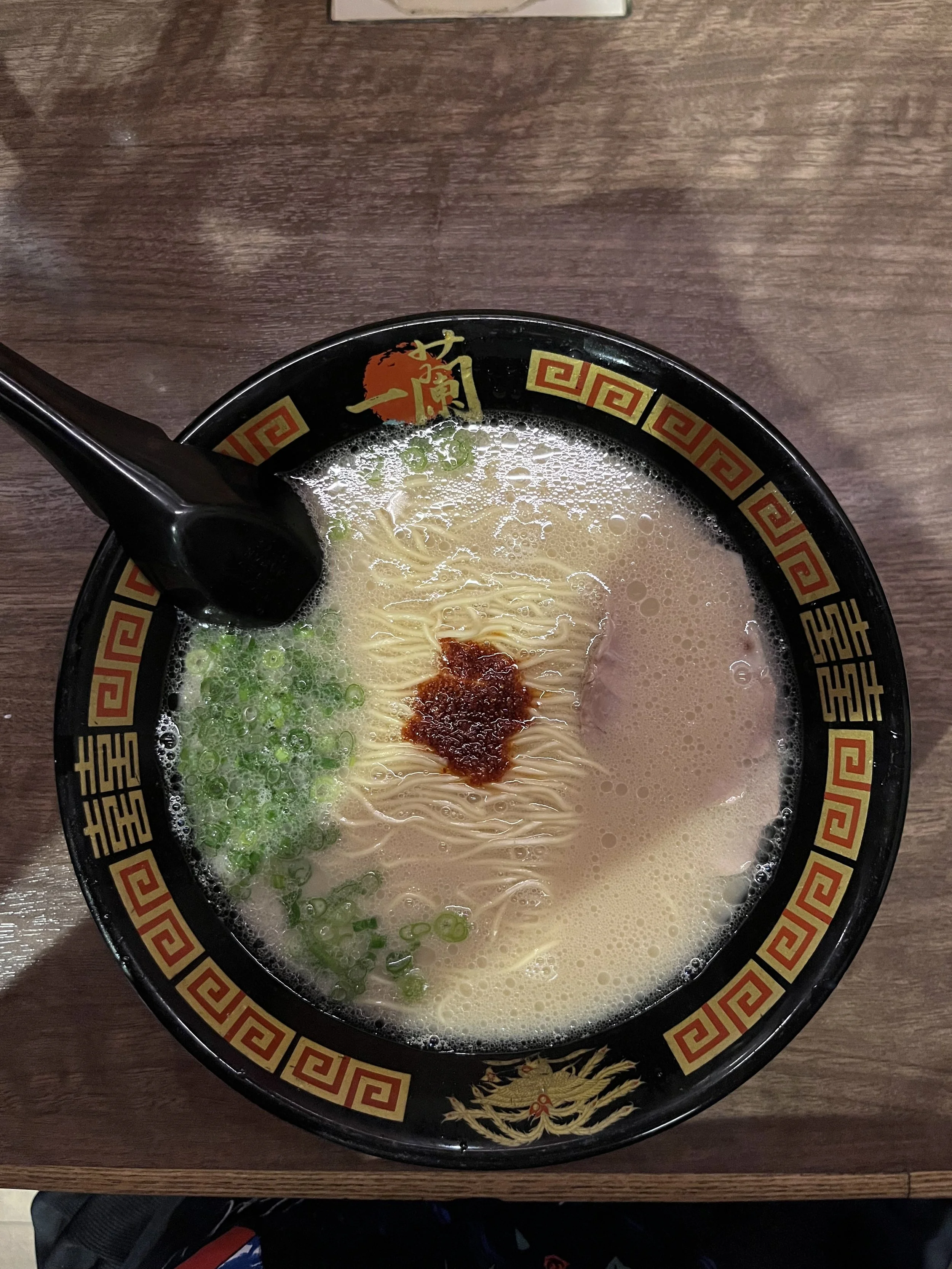 image of tonkotsu ramen with boiled egg and a piece of tonkatsu on top