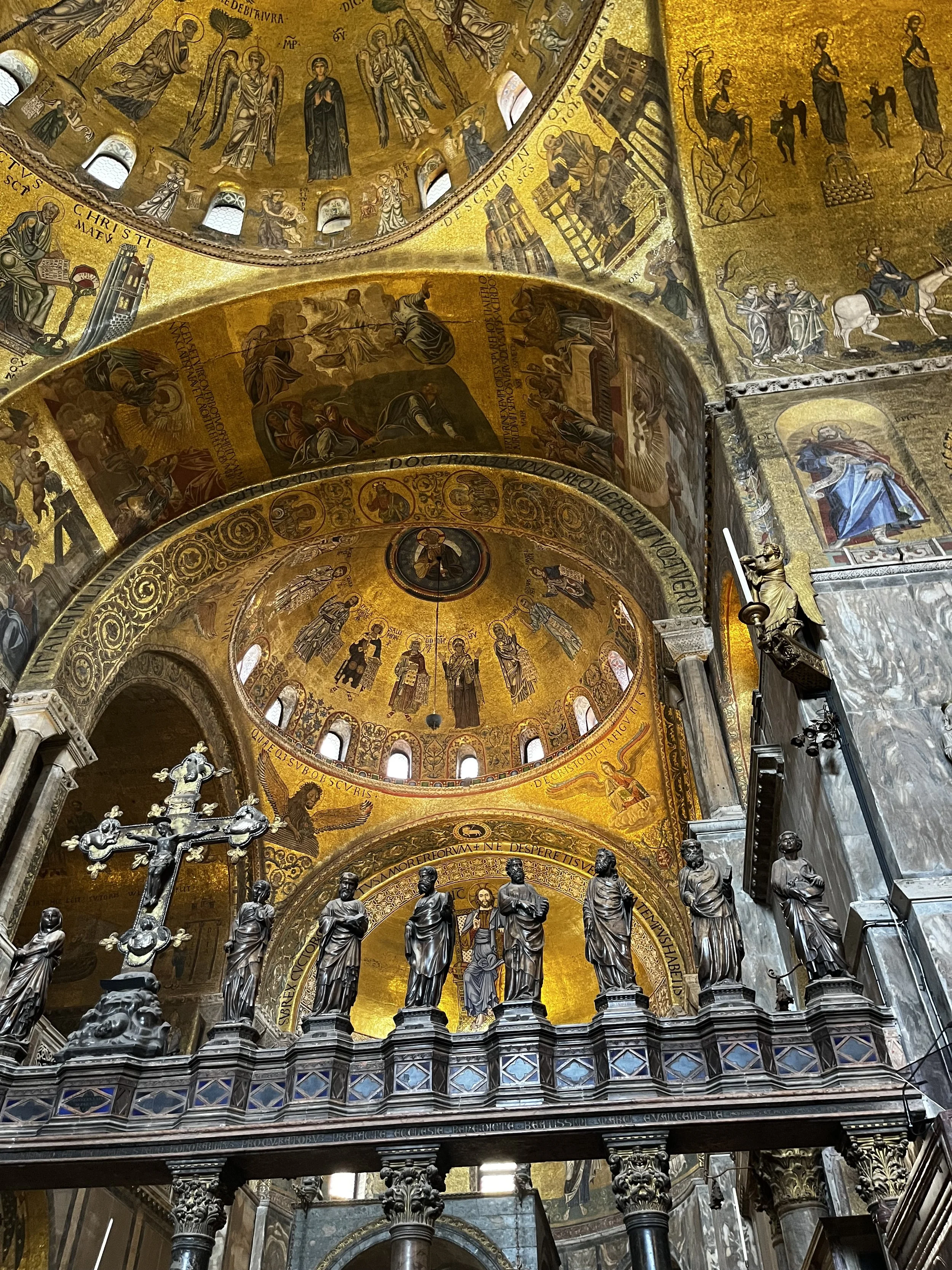 Gold mosaic dome and statues inside St Mark's Basilica Venice