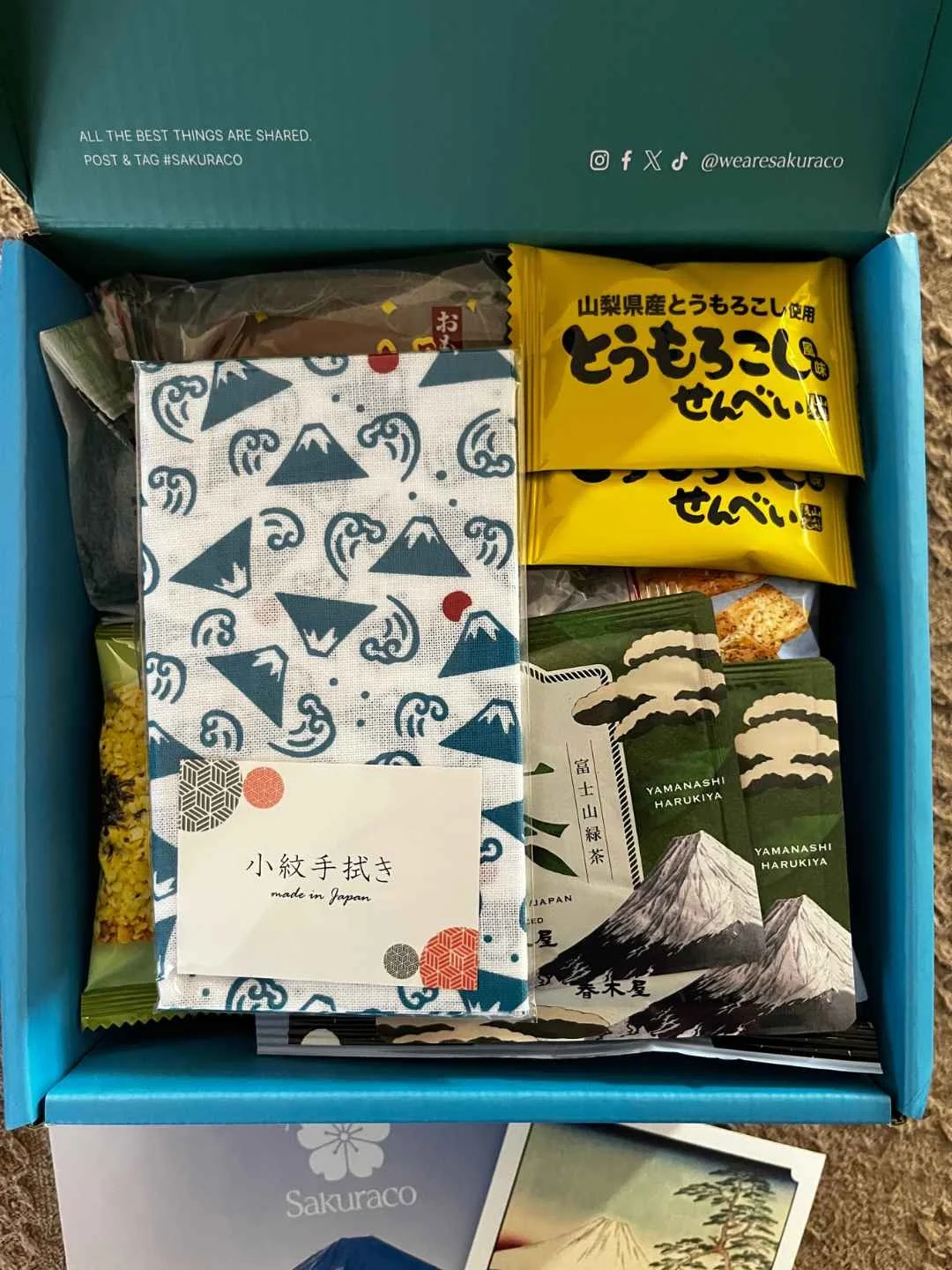 Blue and white Mt. Fuji patterned tenugui towel from the Sakuraco Japanese snack box