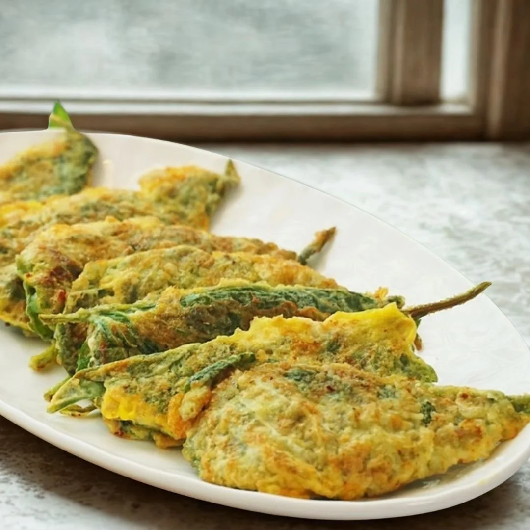 plate of stuffed perilla leaves on counter near window