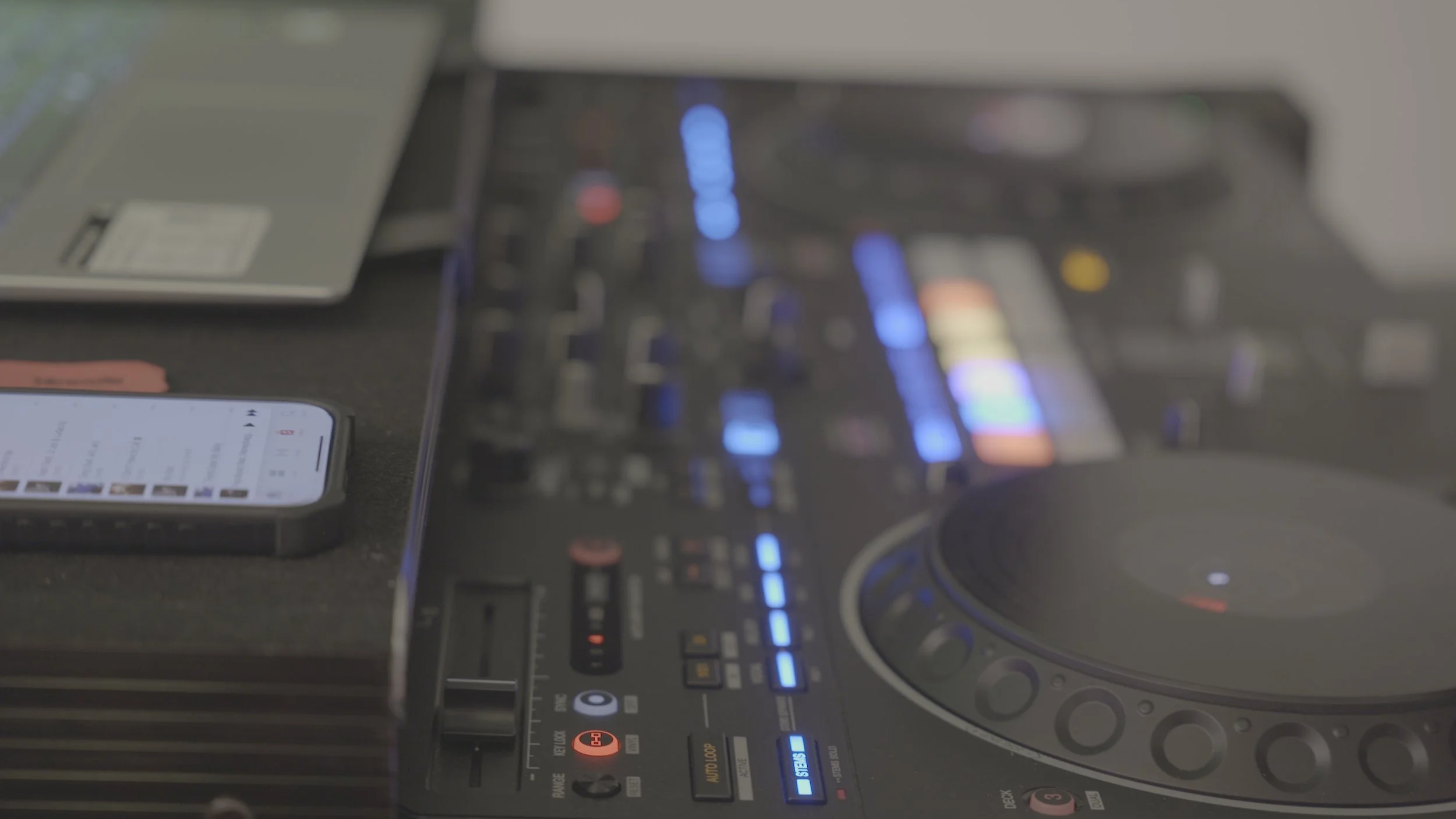 DJ controller and laptop setup prepared for a professional event.