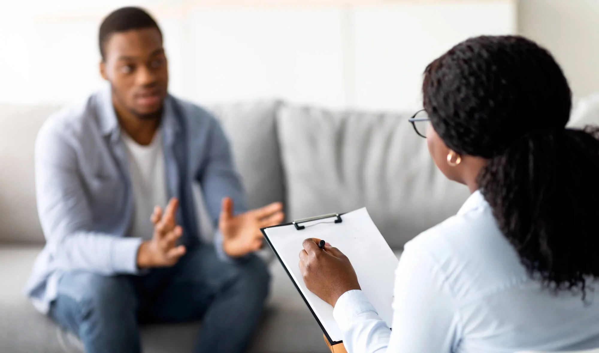 Black man speaking with a therapist during an affordable therapy session in Atlanta.