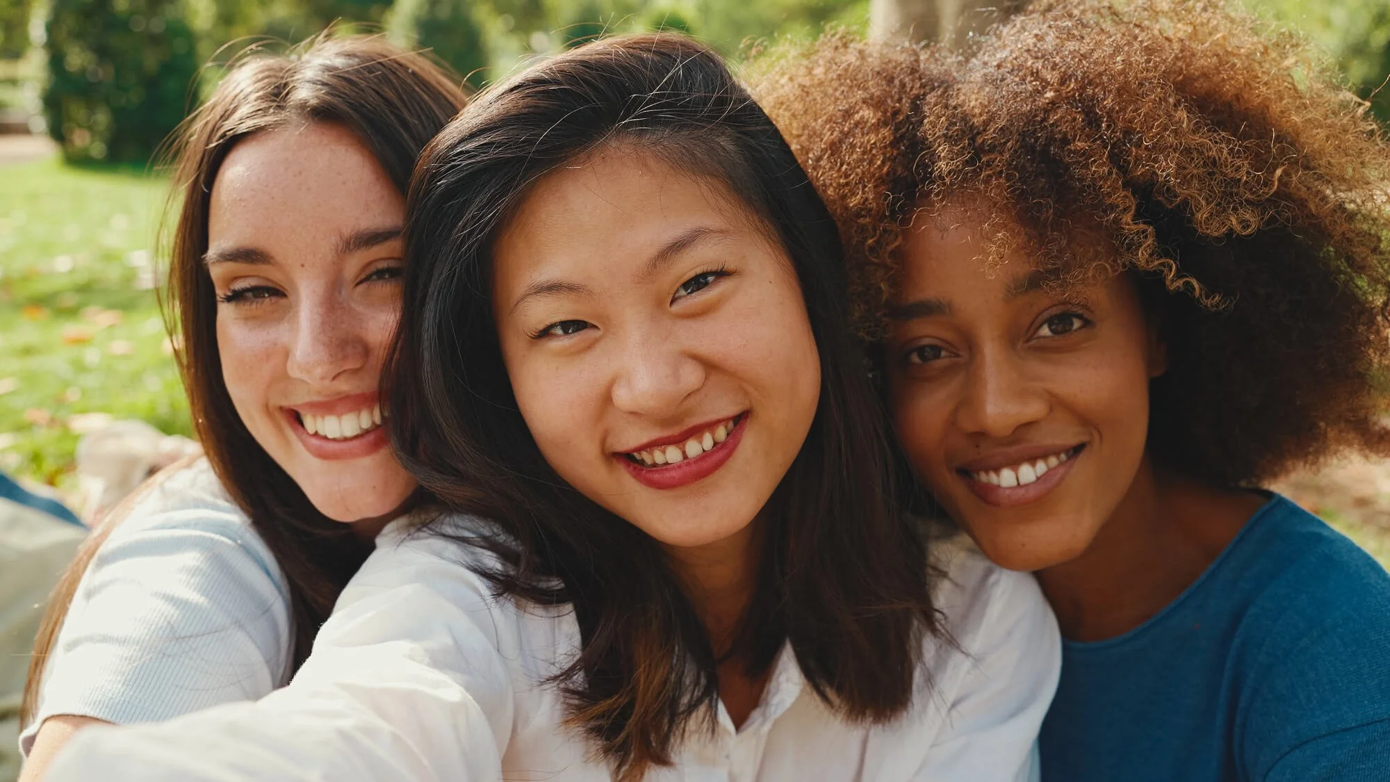 Diverse women smiling together, reflecting connection, support, and women's counseling services in Dunwoody