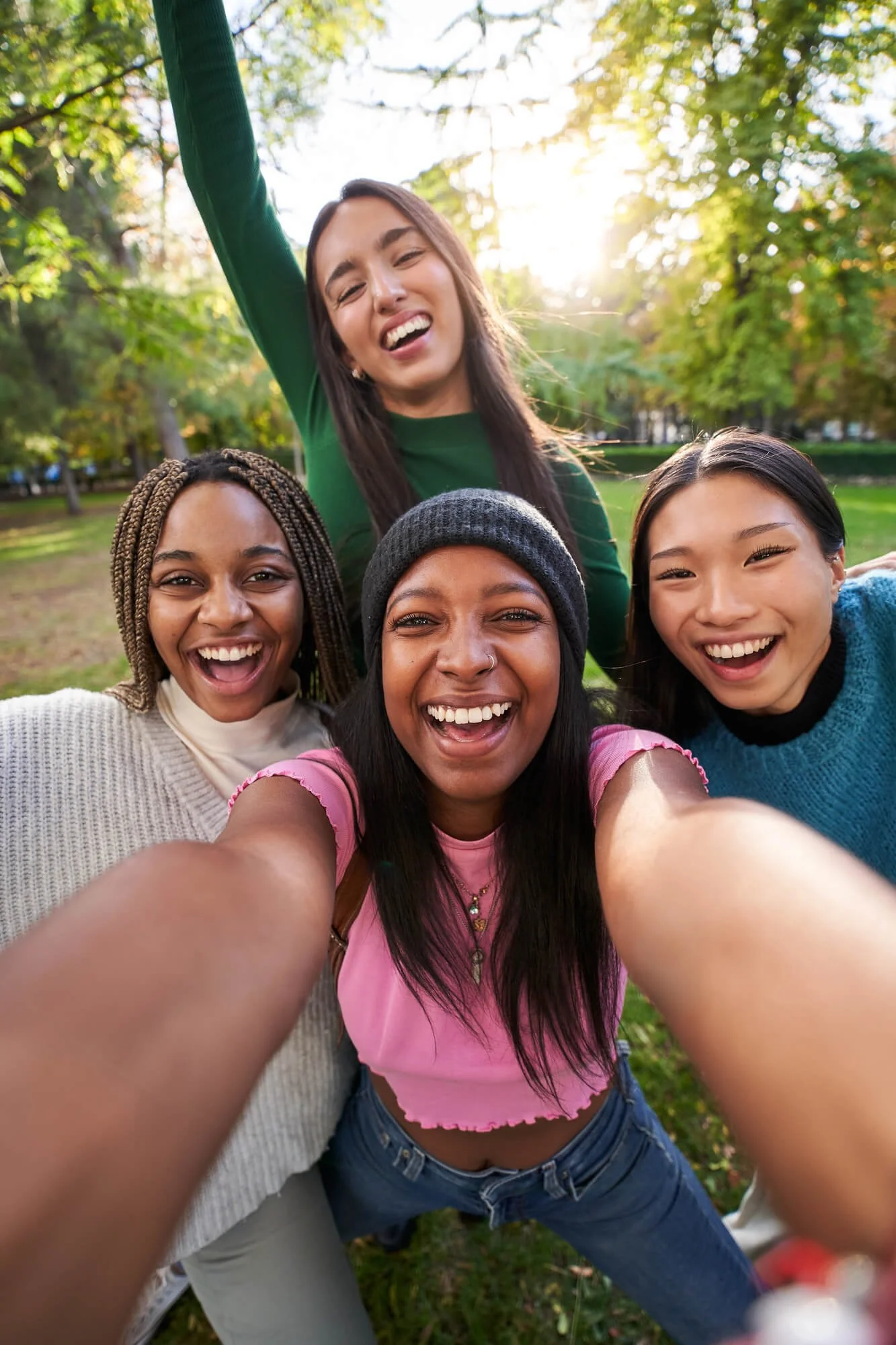 Diverse group of women smiling together outdoors, reflecting connection, support, and counseling services in Dunwoody