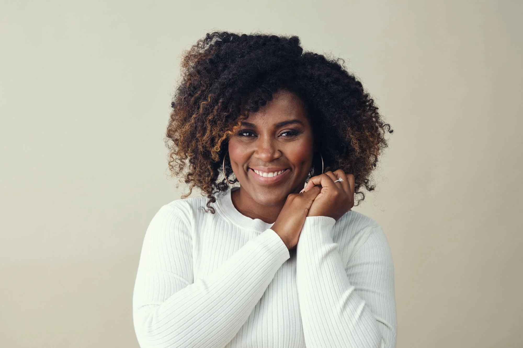 Woman smiling confidently, representing individual therapy, personal growth, and mental wellness support in Dunwoody