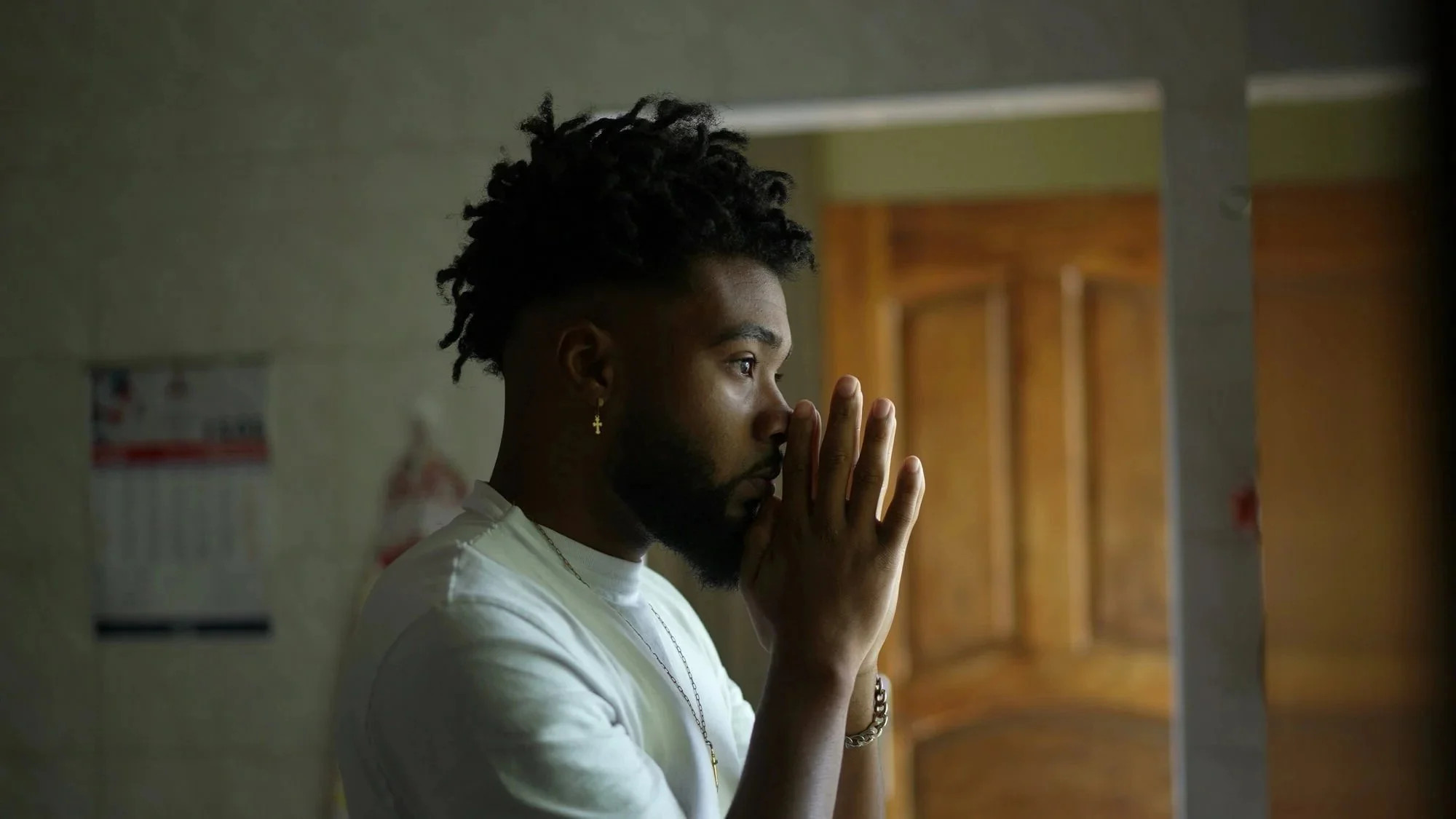 Black man in prayer, representing faith, reflection, and spirituality counseling in Atlanta and Dunwoody, GA.