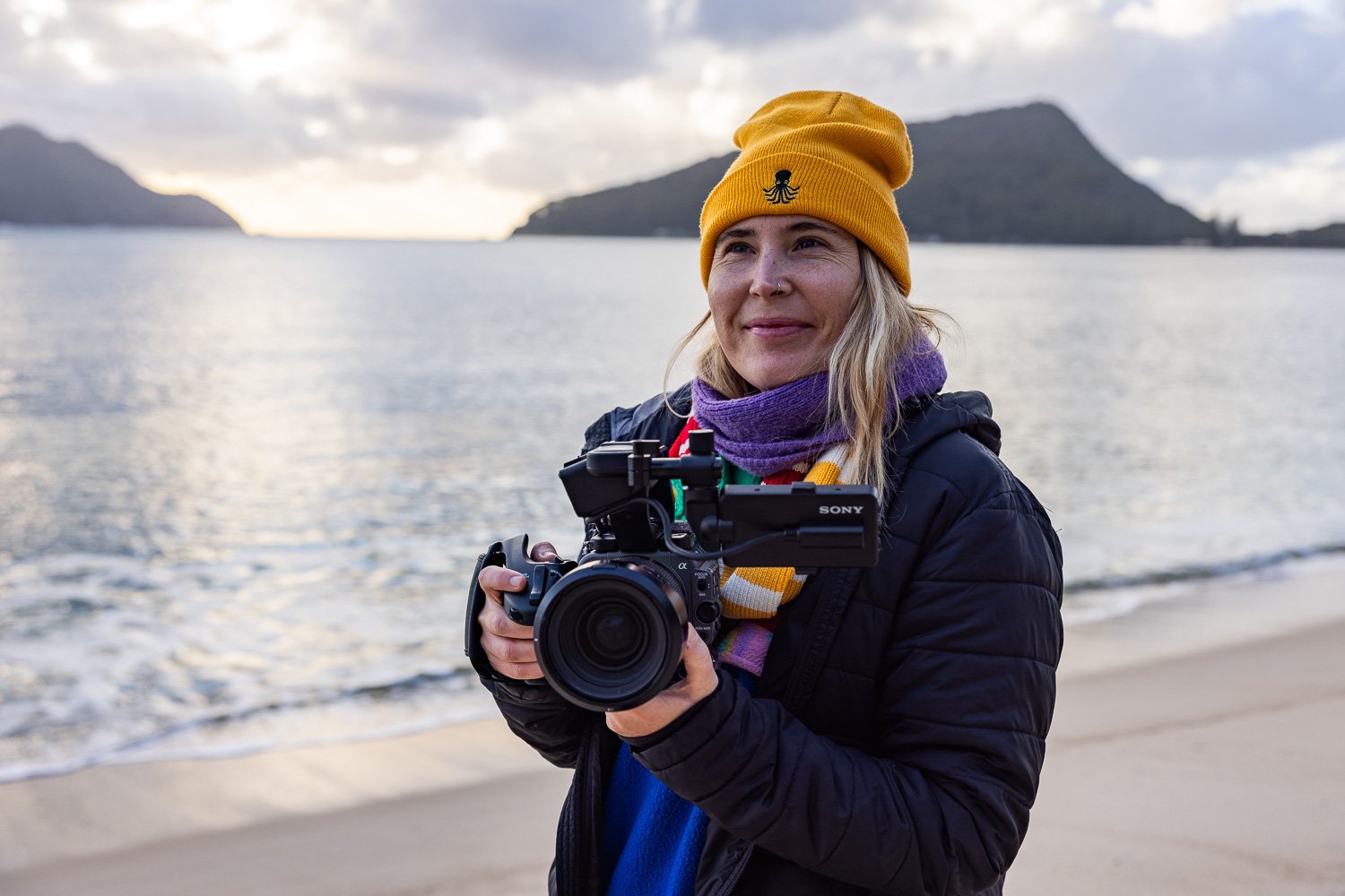 Harriet Spark with a cinema camera on the shore
