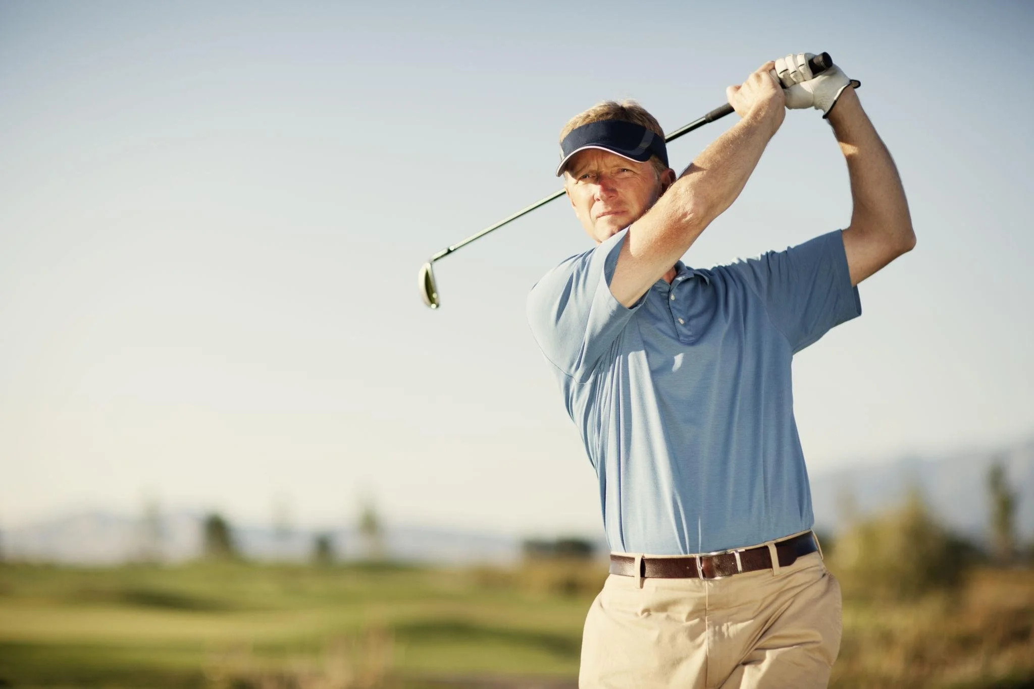 Adult golfer playing golf