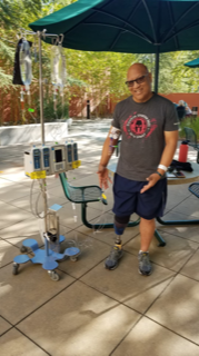 Smiling Nick with prosthetic leg.png