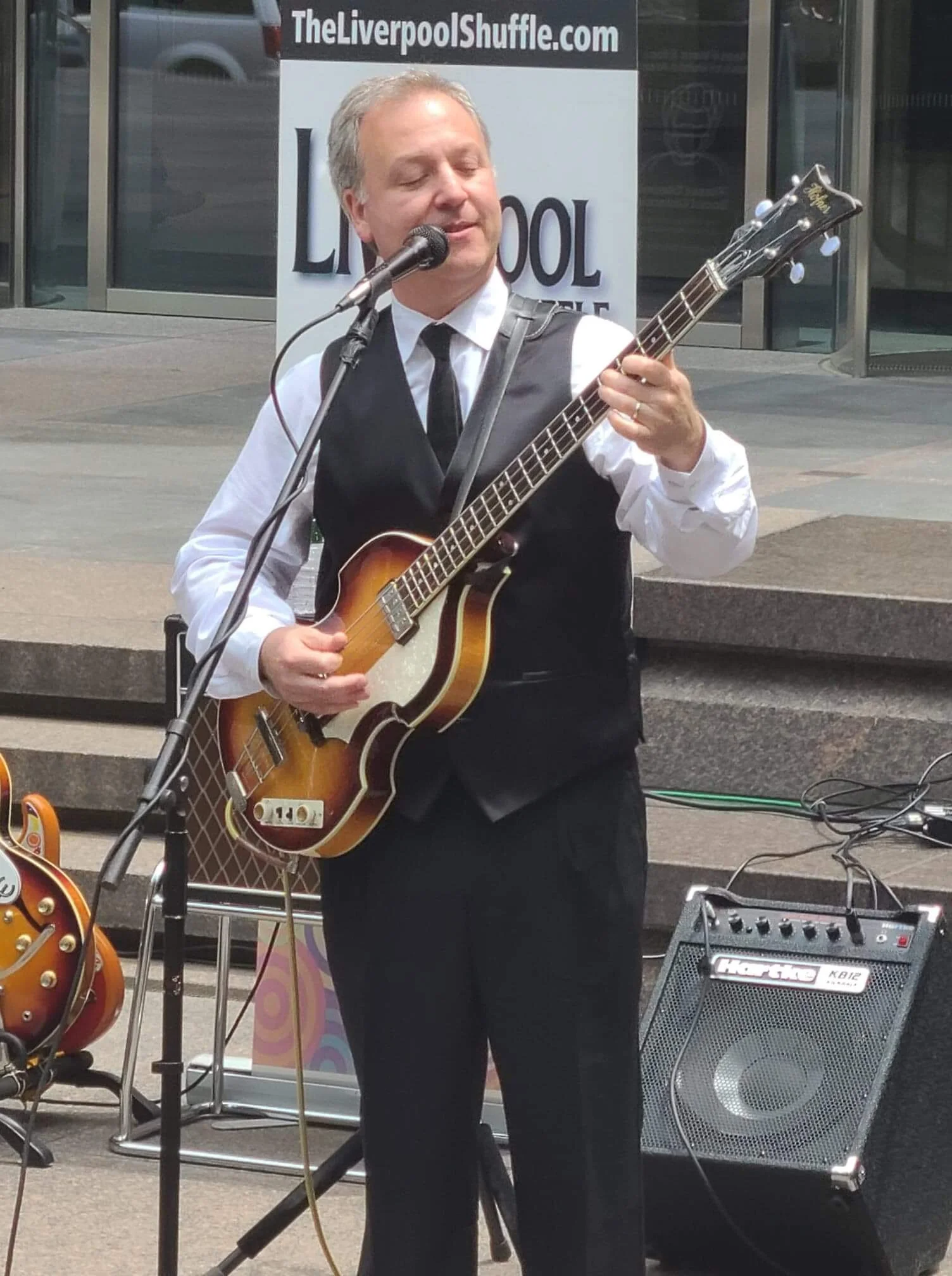 Bassist Andrew Lubman performing with The Liverpool Shuffle, Long Island's TOP Beatle show photographed in NYC at the Summer Solstice Concert on Park Avenue.