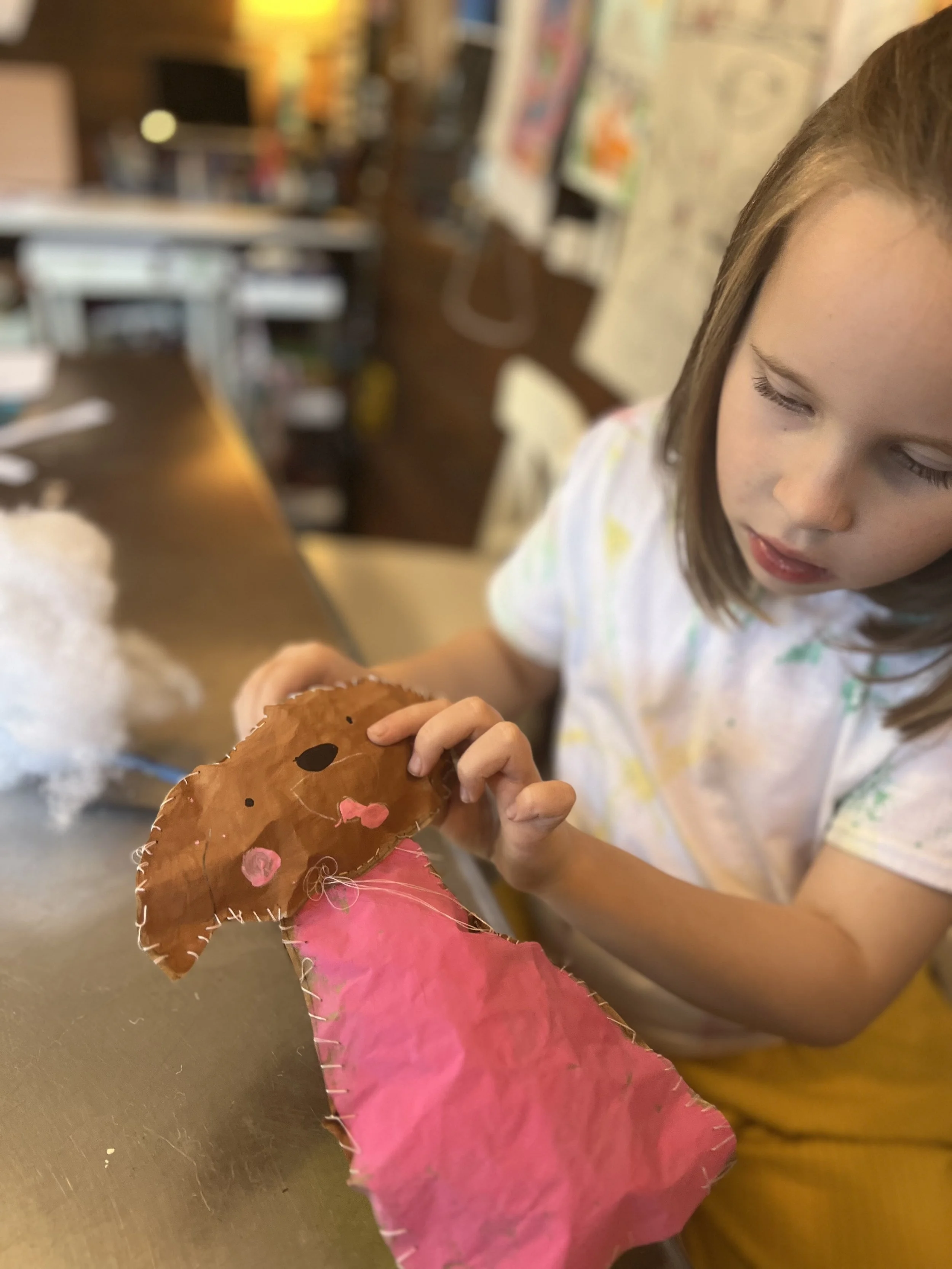 Elsie handstitching her dog.jpeg