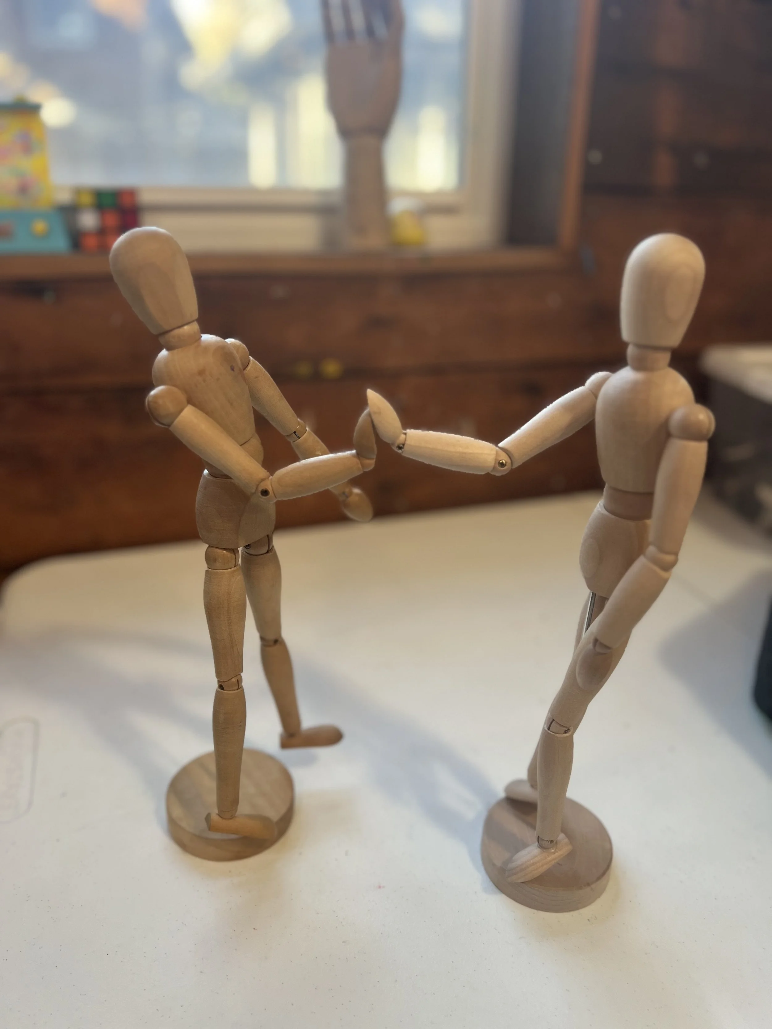 maniquins high fiving.jpeg