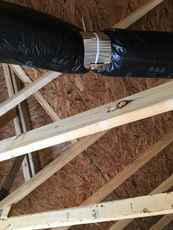 Insulated flex duct installed with a Thermopan flex duct saddle