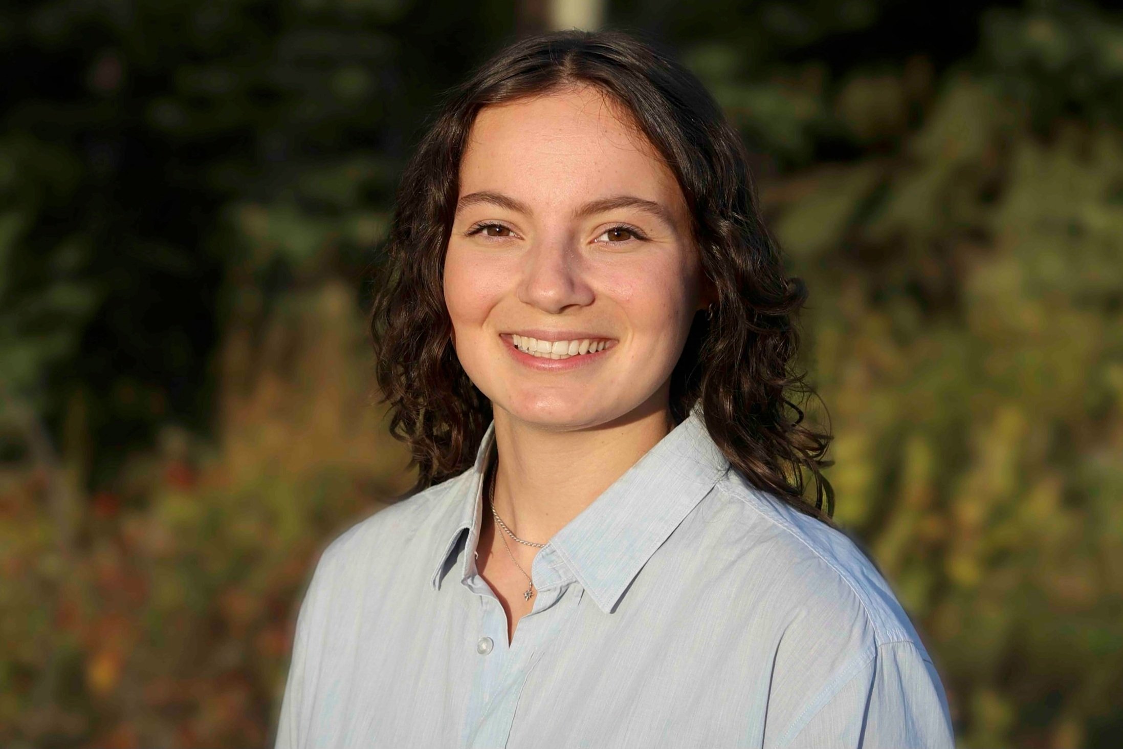 Portrait of law clerk with medium dark hair.