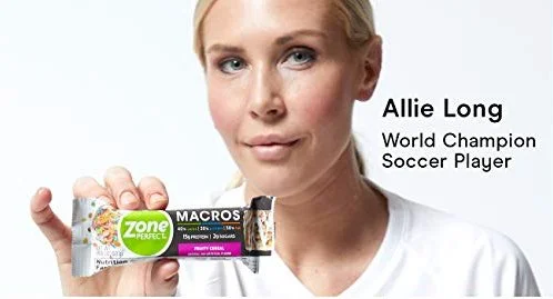 Allie Long, world champion soccer player, holding a ZonePerfect Macros protein bar.