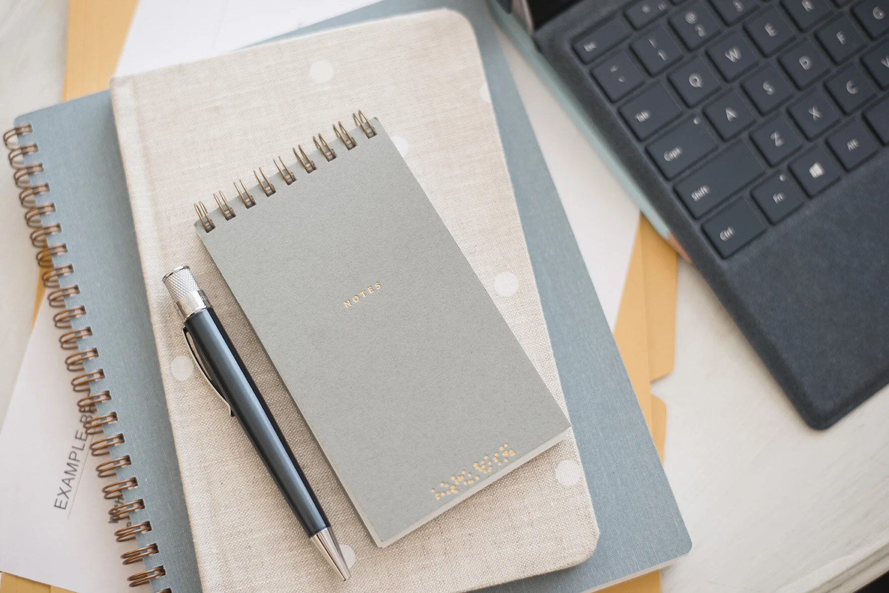 LighthouseAdvisory_notebook stack_web.jpg