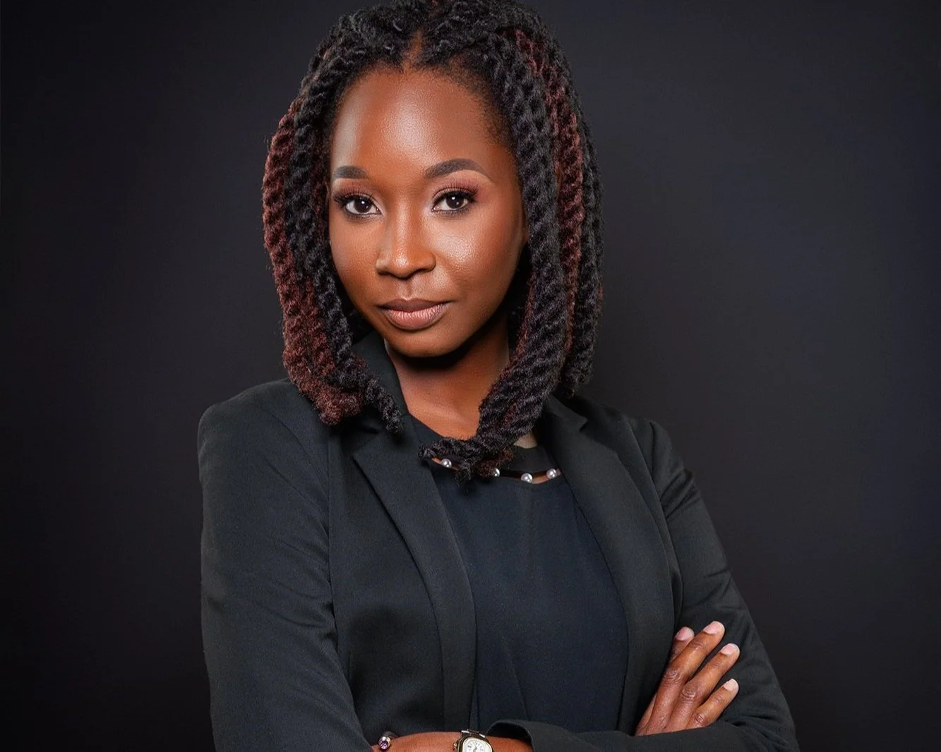 Dr. Crookendale, Internist, in a black suit looking at the camera.