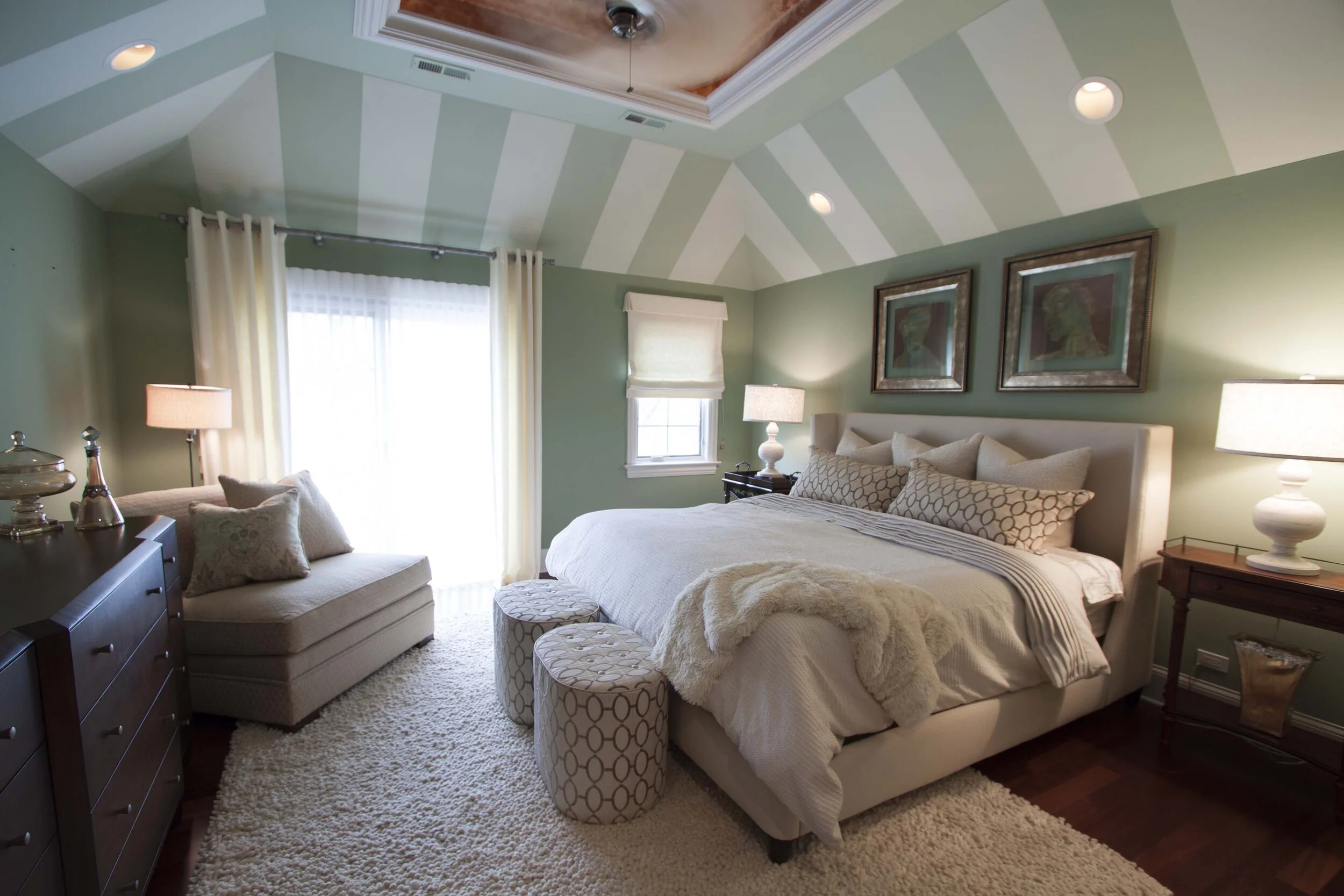 Master bedroom with striped ceiling and king upholstered bed by Adam Zollinger Interiors