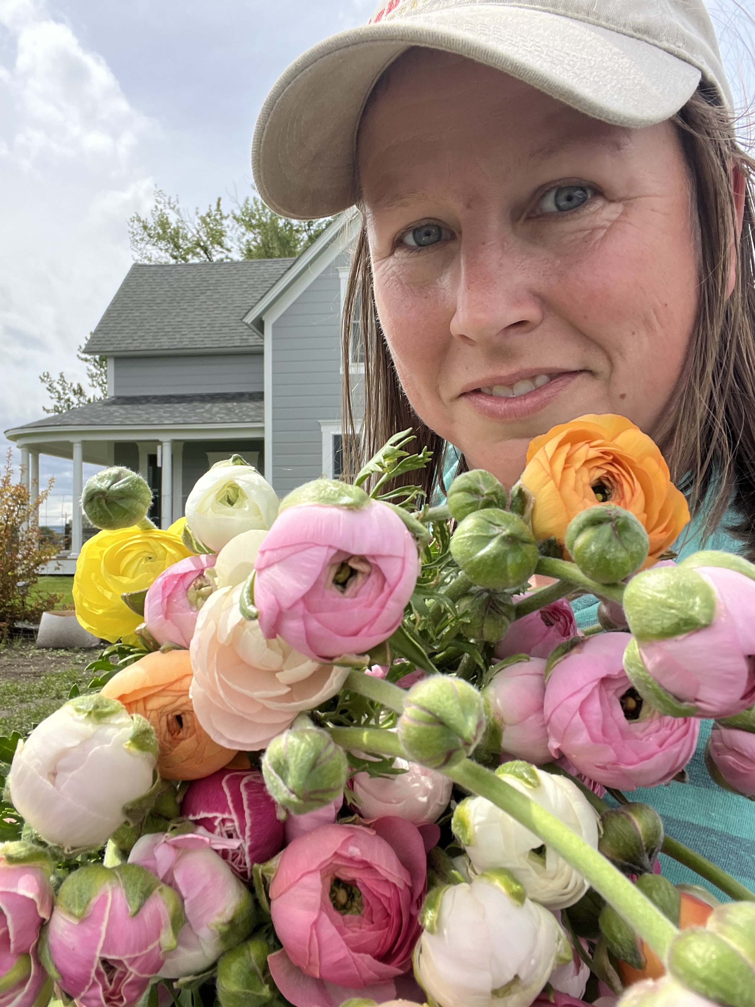 selfie with an armload of flowers