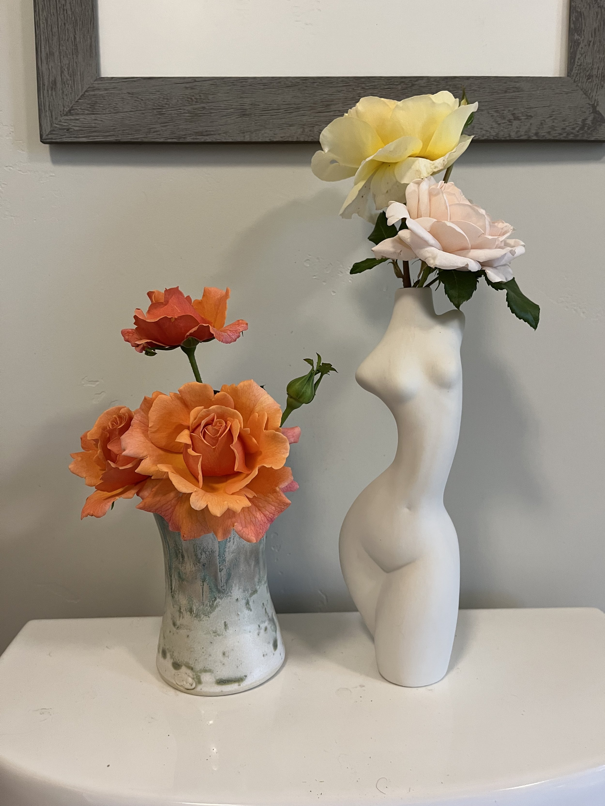 two vases of roses